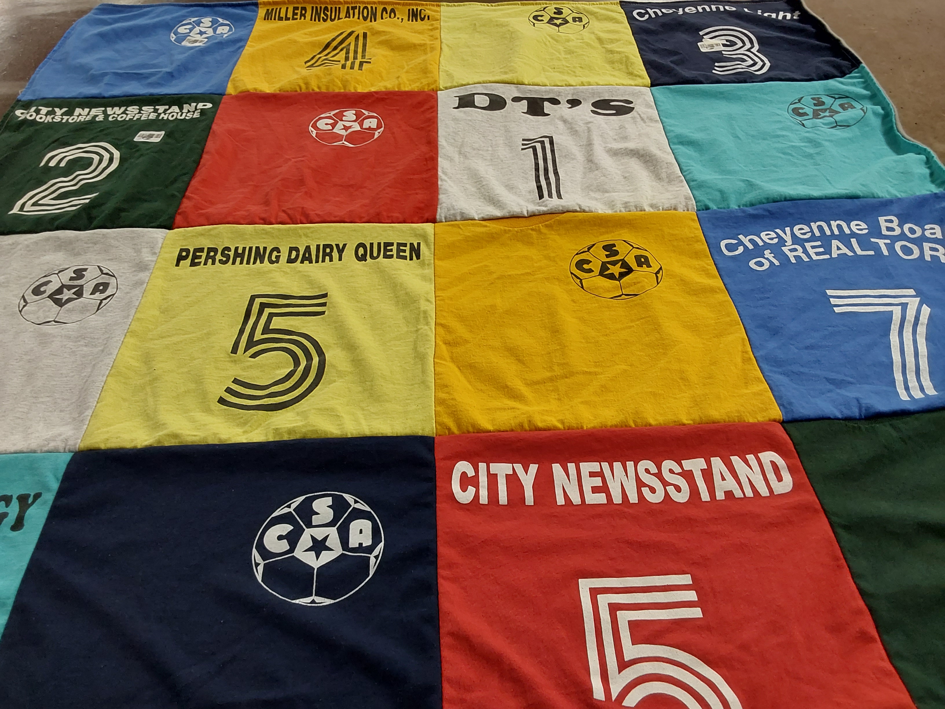T-shirt quilt with soccer, local businesses themes by Sherry from WY