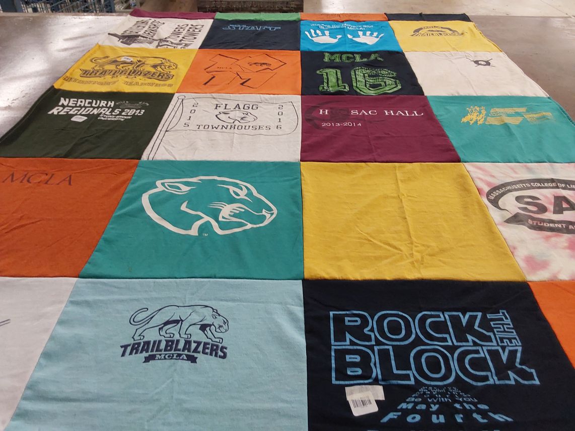 T-shirt quilt featuring massachusetts college of liberal arts trailblazers by Kim from NY