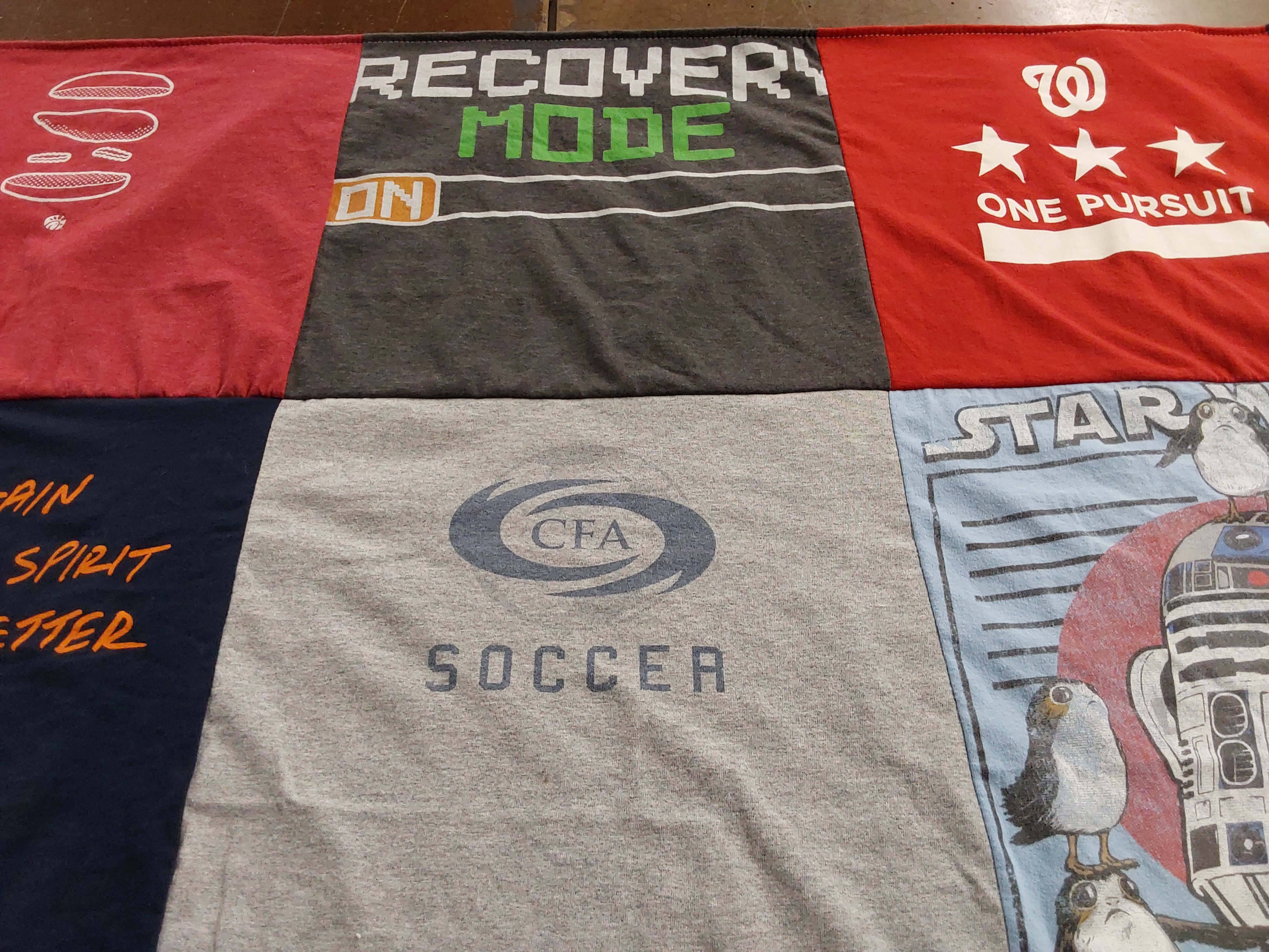 T-shirt quilt with sports, fitness themes by Sharon from VA