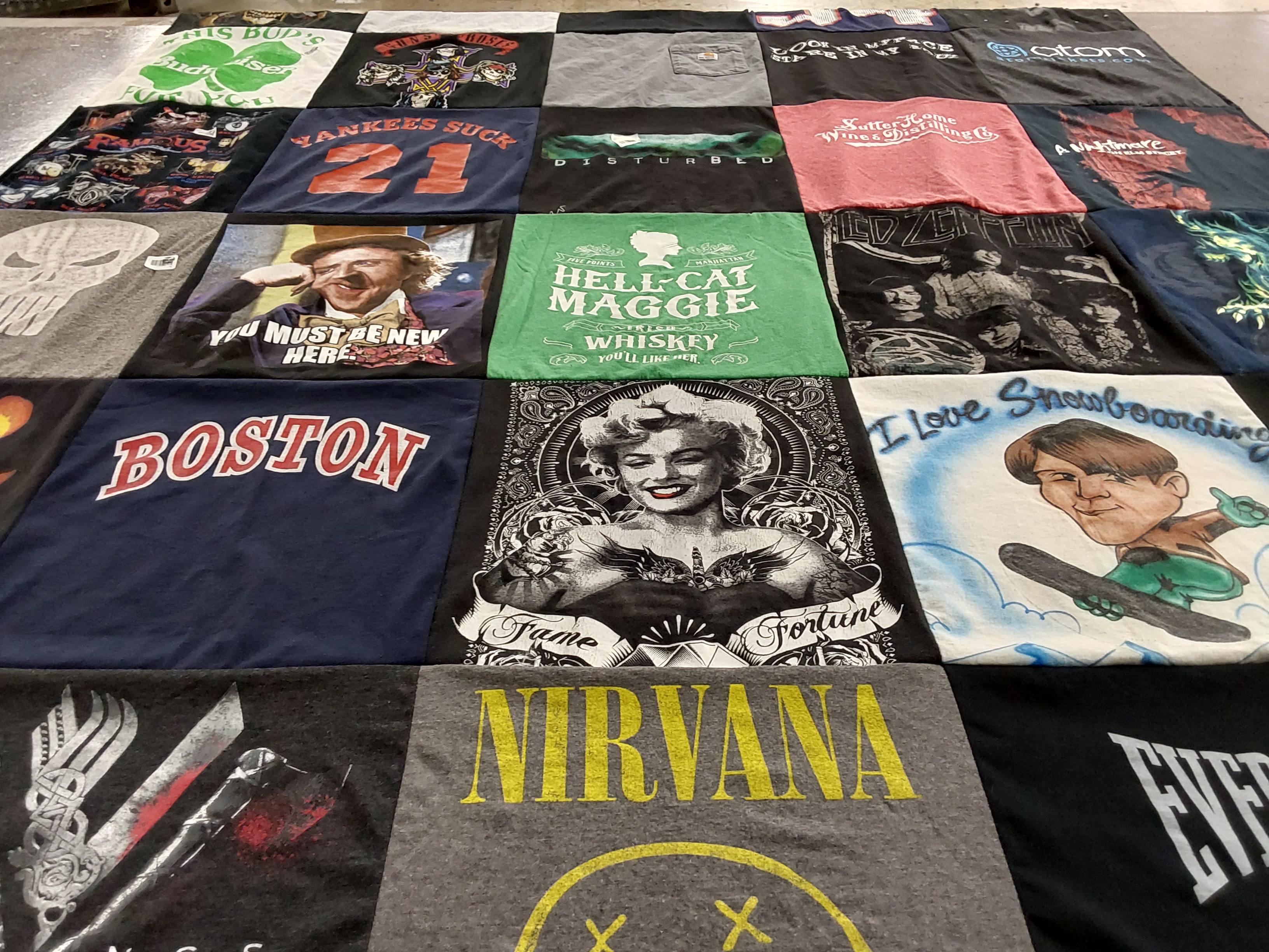 T-shirt quilt with sports, music themes by Ann from MA