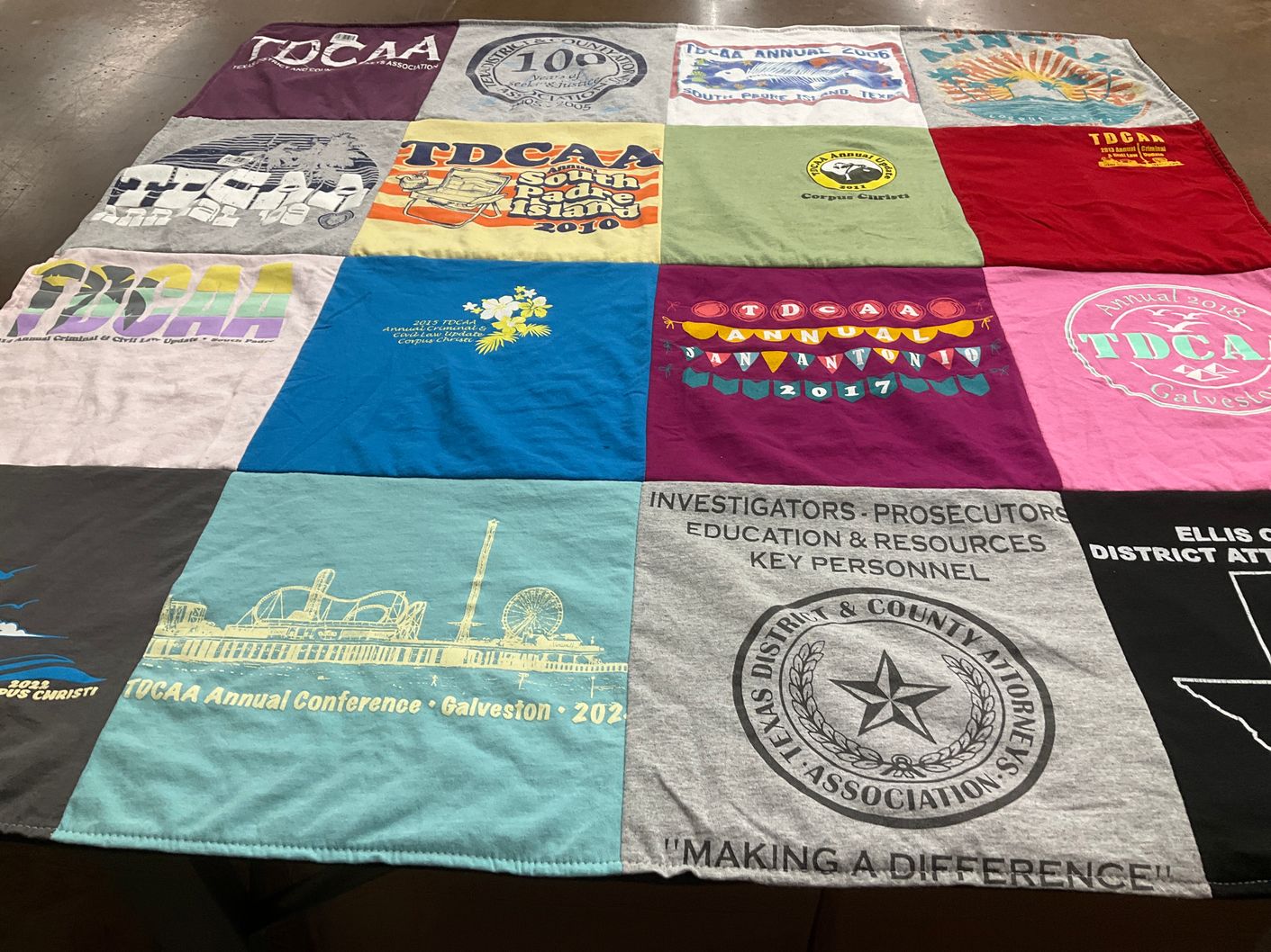 T-shirt quilt with law, criminal justice themes by Ann from TX