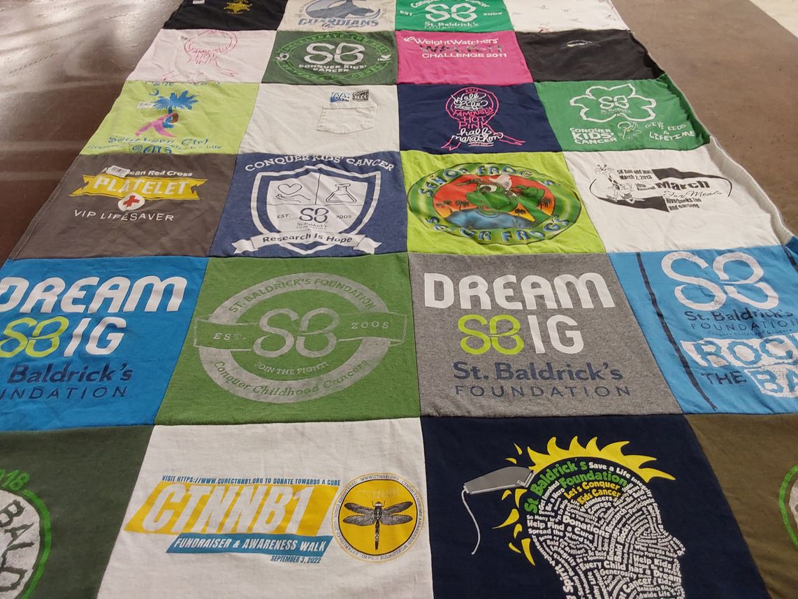 T-shirt quilt with childhood cancer awareness, fundraising themes by Krystle from SC