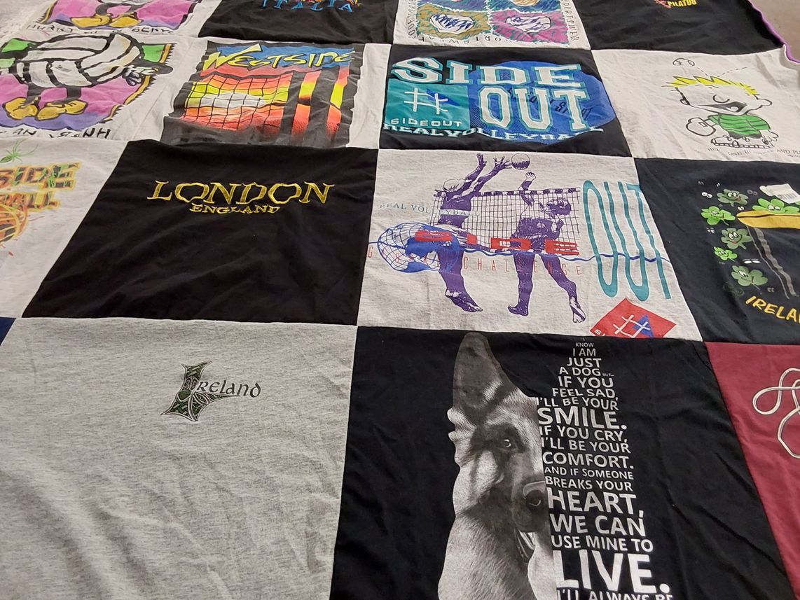 T-shirt quilt with travel, sports themes by Susan from CA