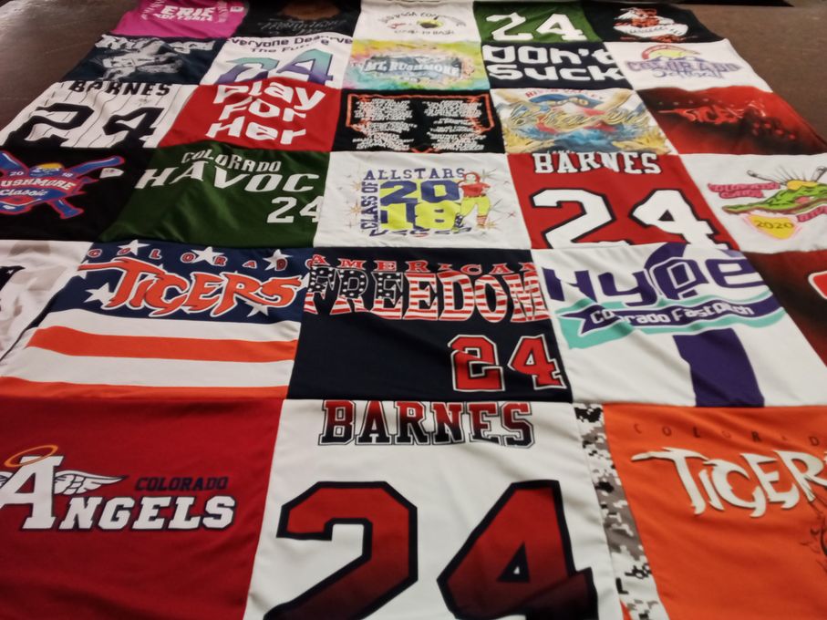 T-shirt quilt with sports, community themes by Doug from CO