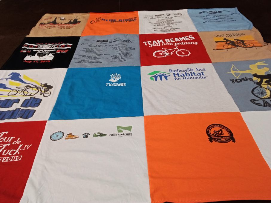 T-shirt quilt with cycling, community service themes by Elaine from NC