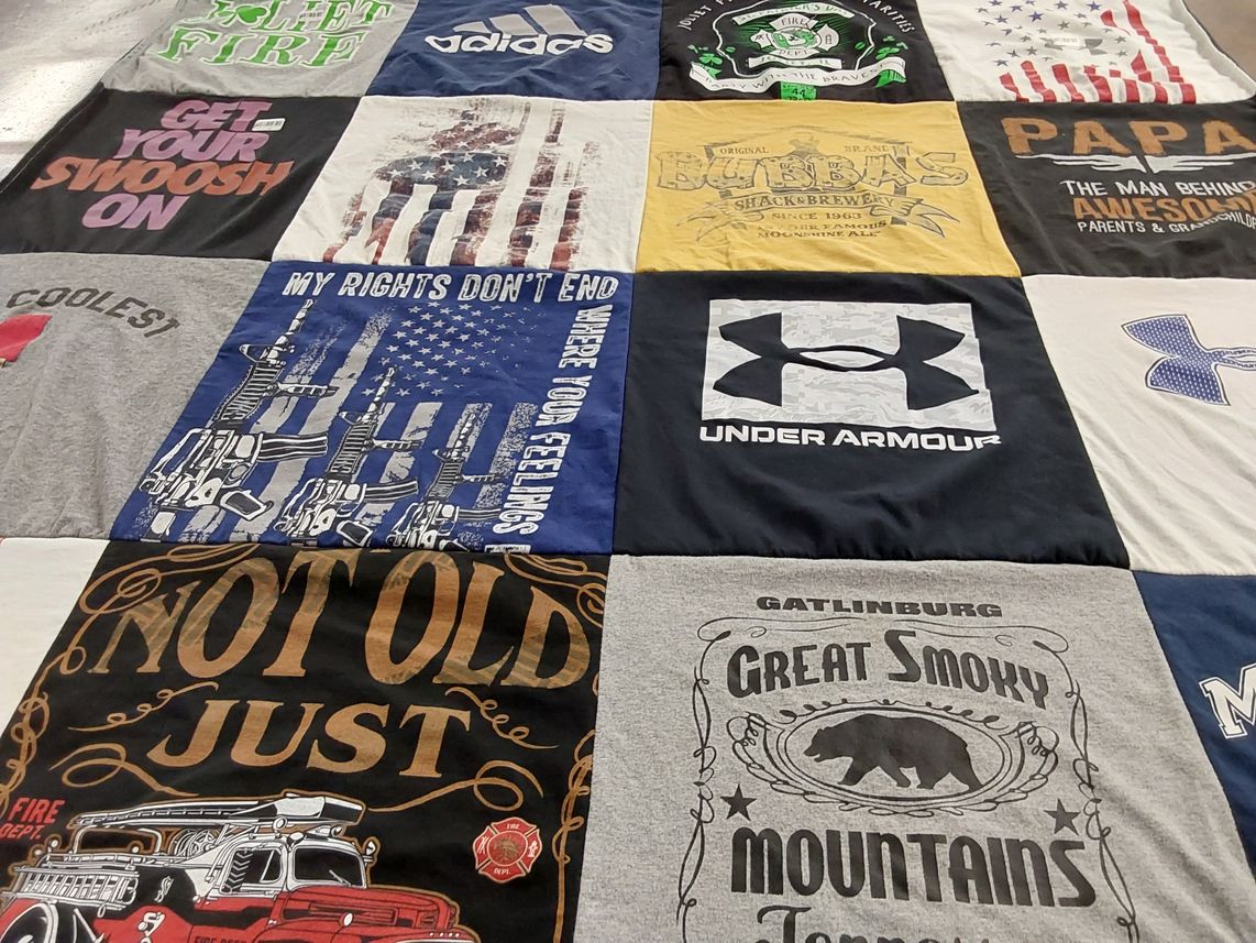 T-shirt quilt with firefighting, outdoor themes by Cindy from IL
