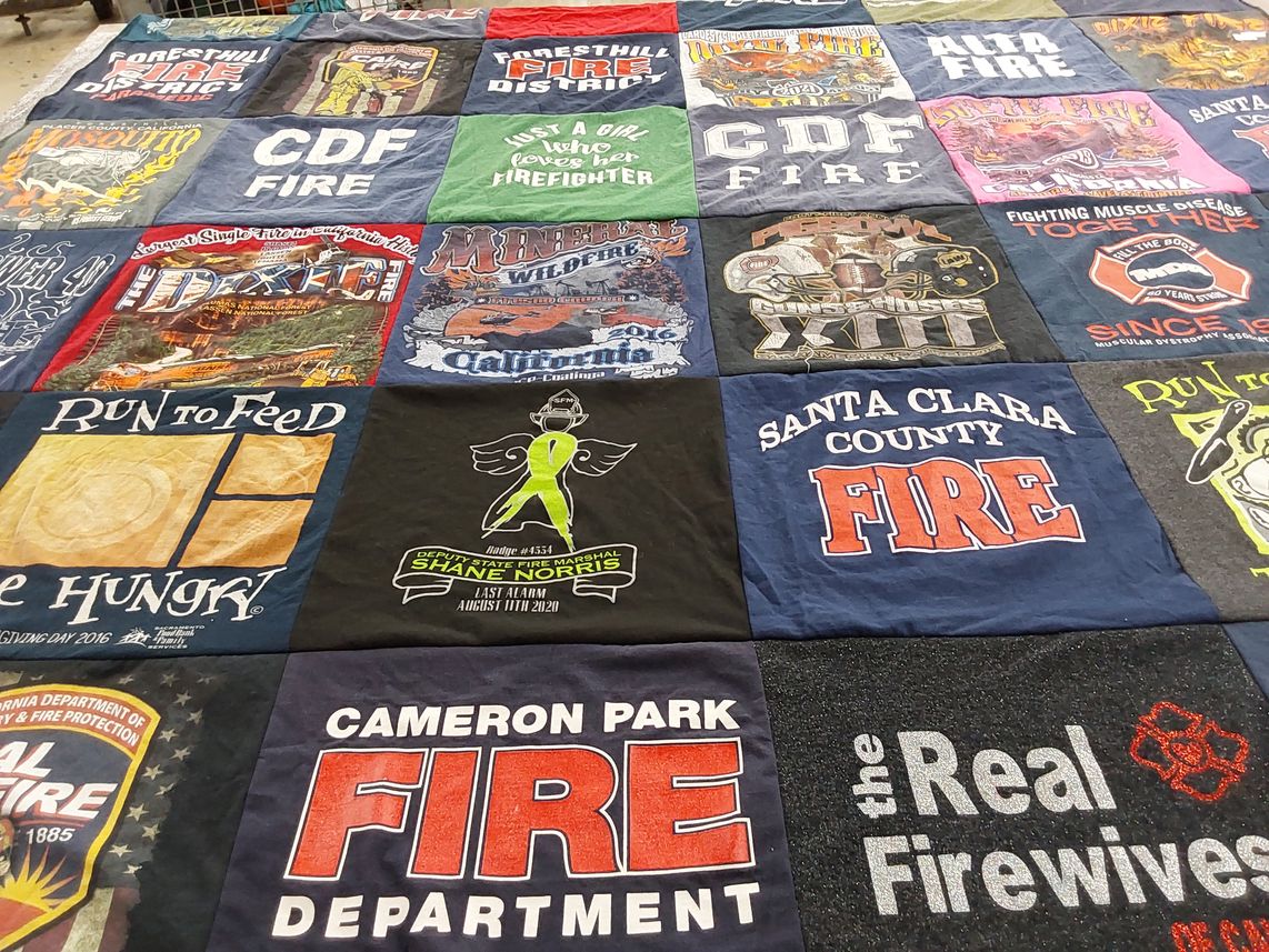 T-shirt quilt with firefighting, community service themes by Kellie from CA