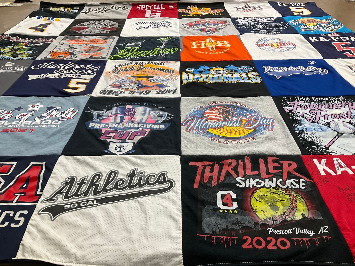 T-shirt quilt with sports, athletics themes by Ann from CA