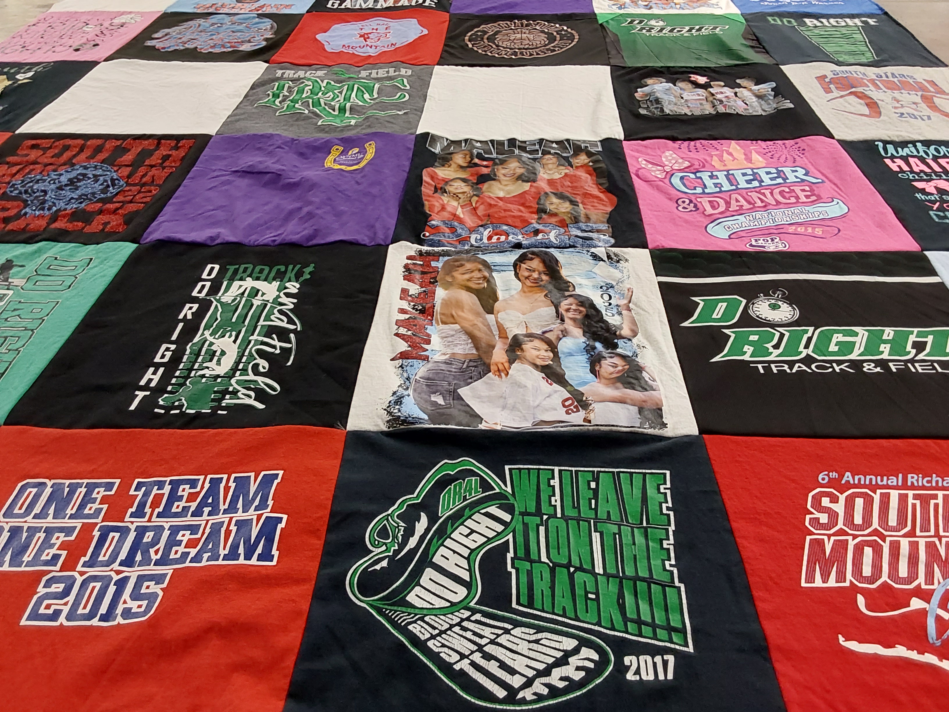 T-shirt quilt with track and field, cheerleading themes by Michaela from AZ