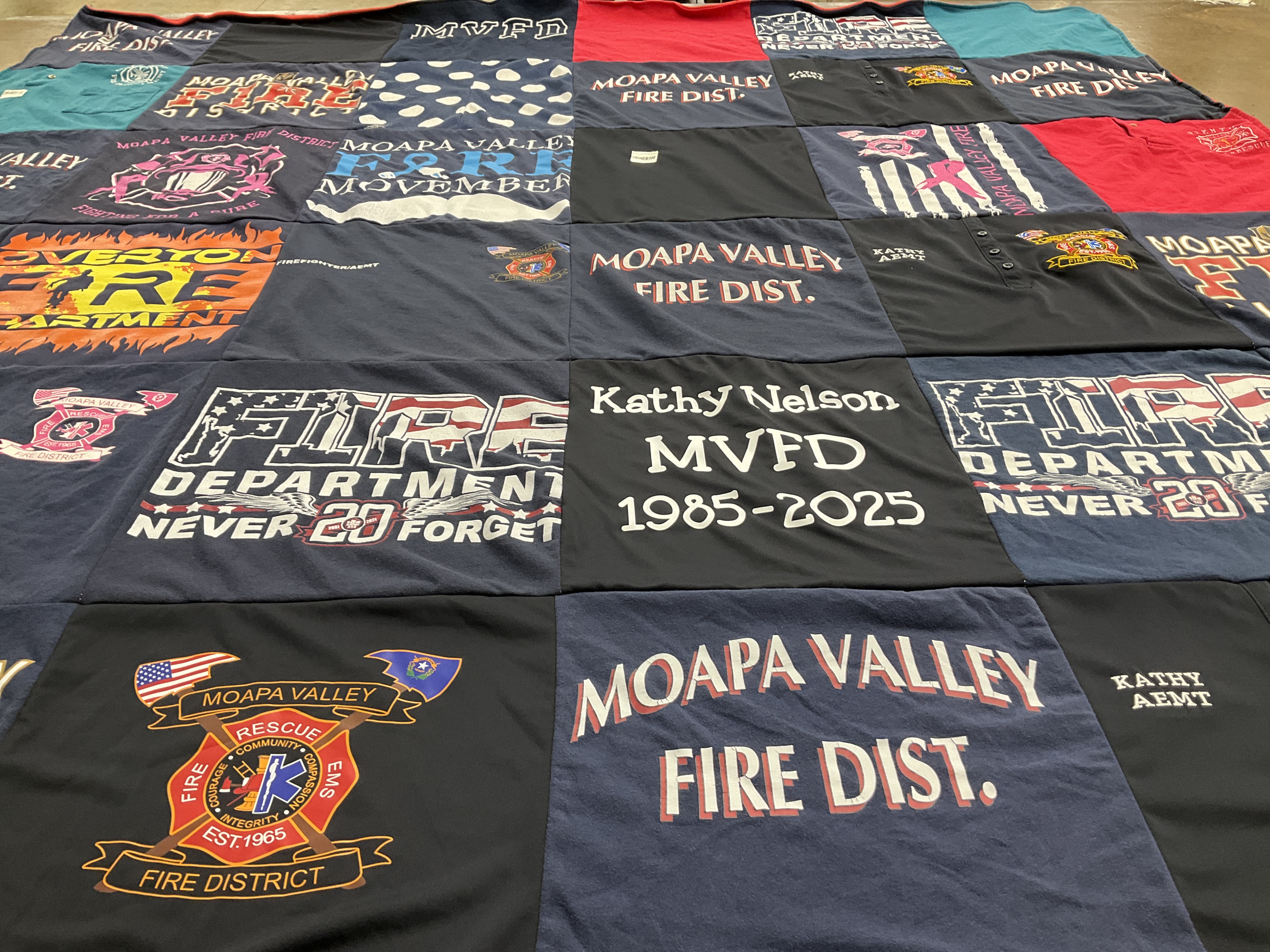 T-shirt quilt with firefighting, community service themes by Alecia A. from NV