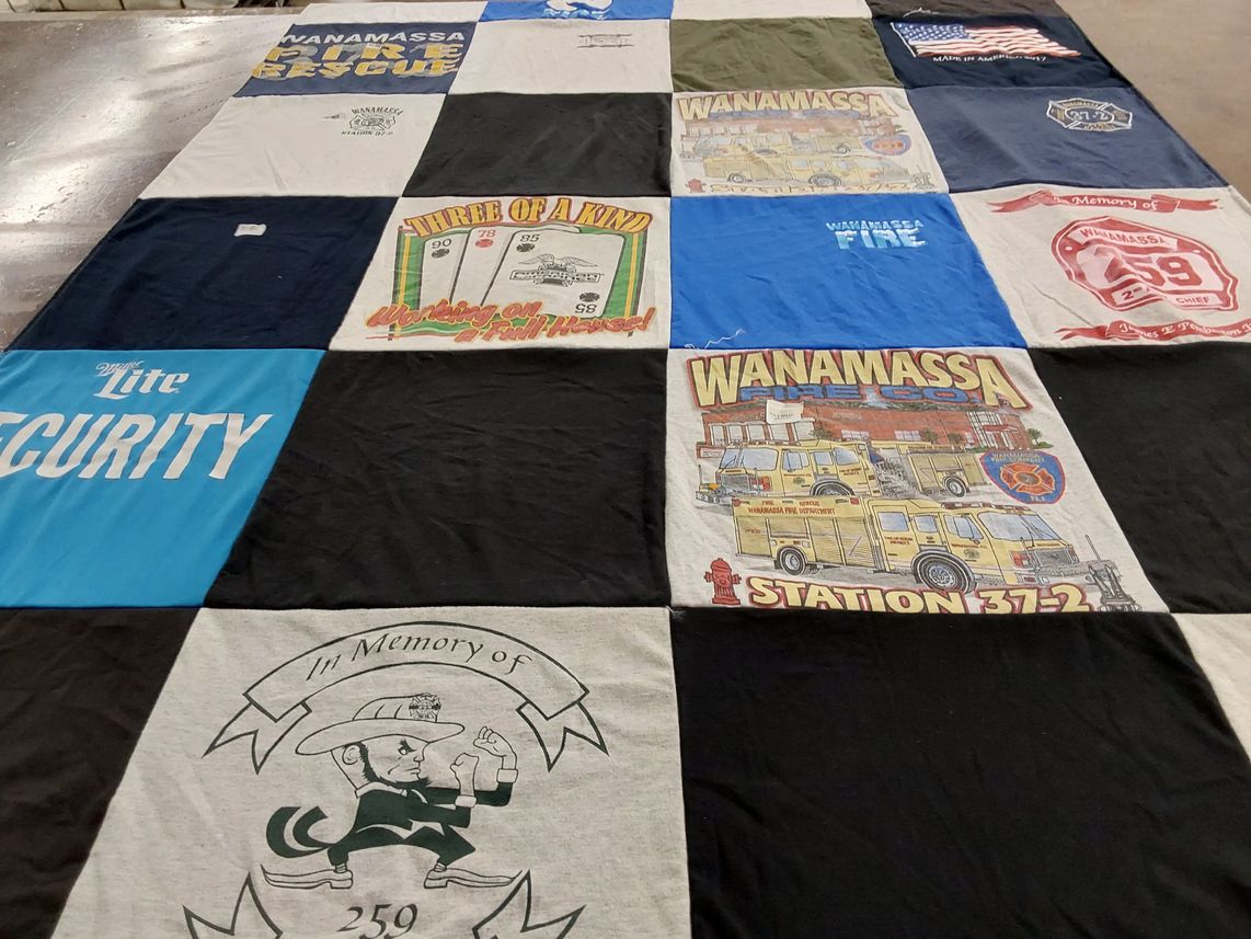 T-shirt quilt with firefighting, community service themes by Phyllis from NJ
