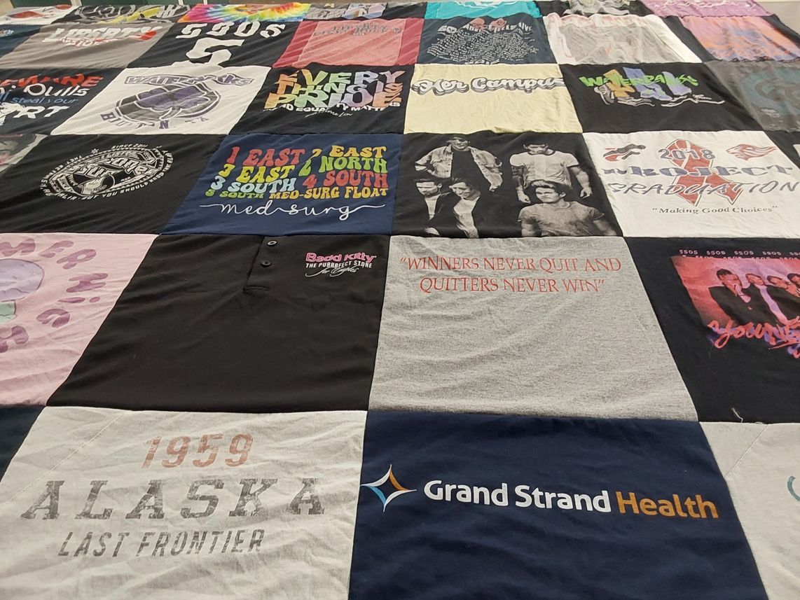 T-shirt quilt with health, graduation themes by Michelle from NC