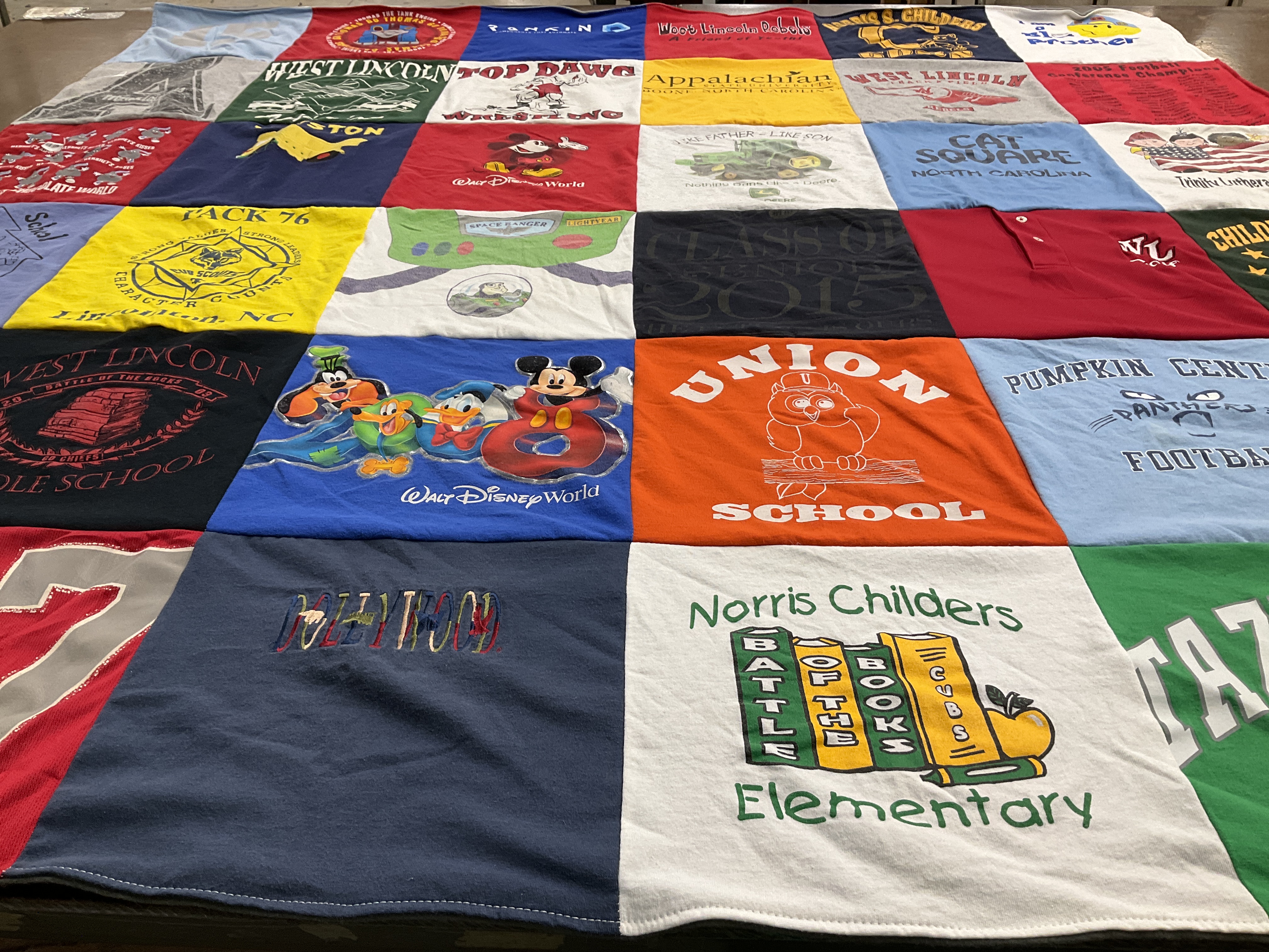 T-shirt quilt featuring pumpkin center football by Lori from NC