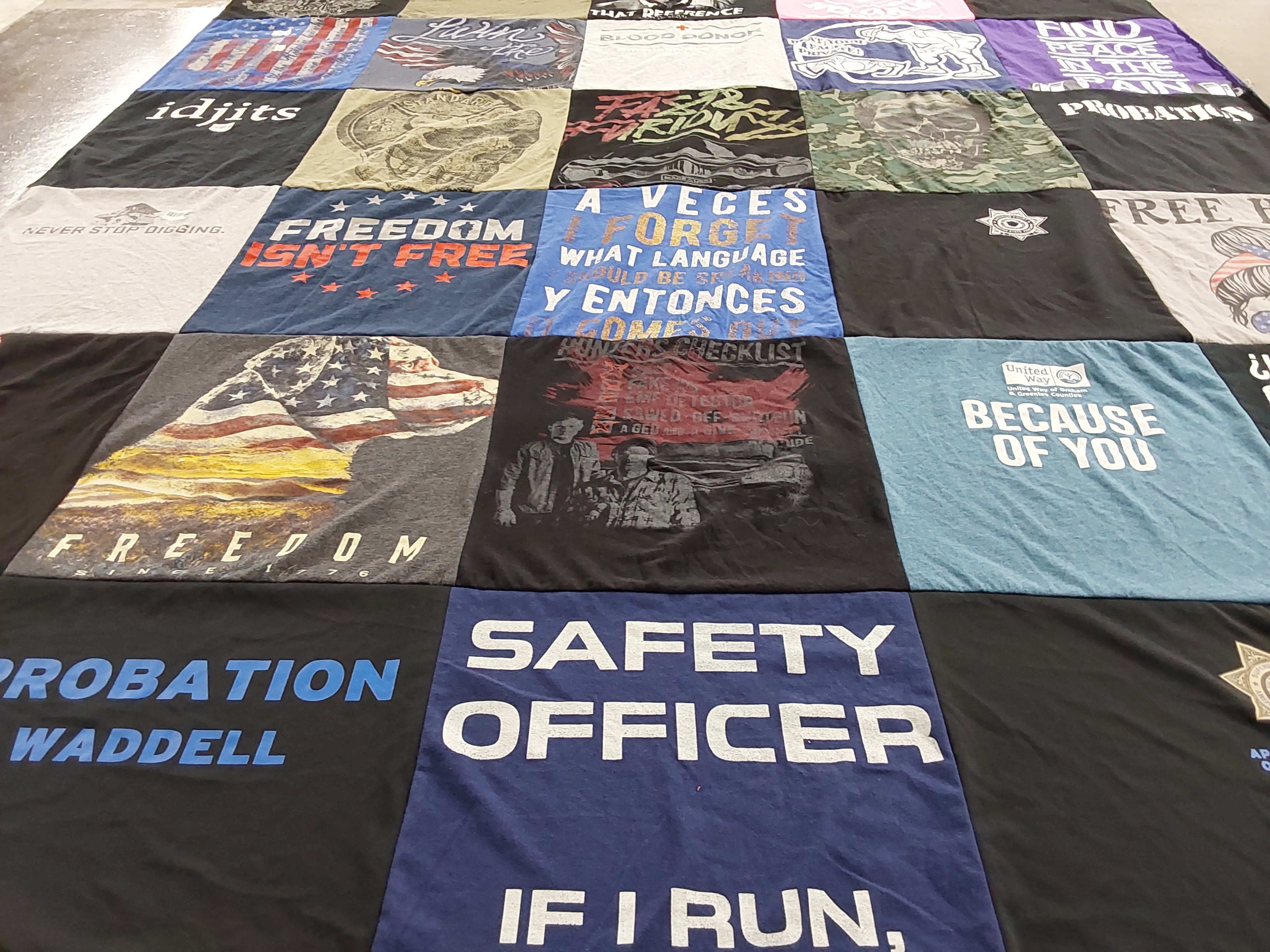 T-shirt quilt with veterans, law enforcement themes by Carrie from AZ