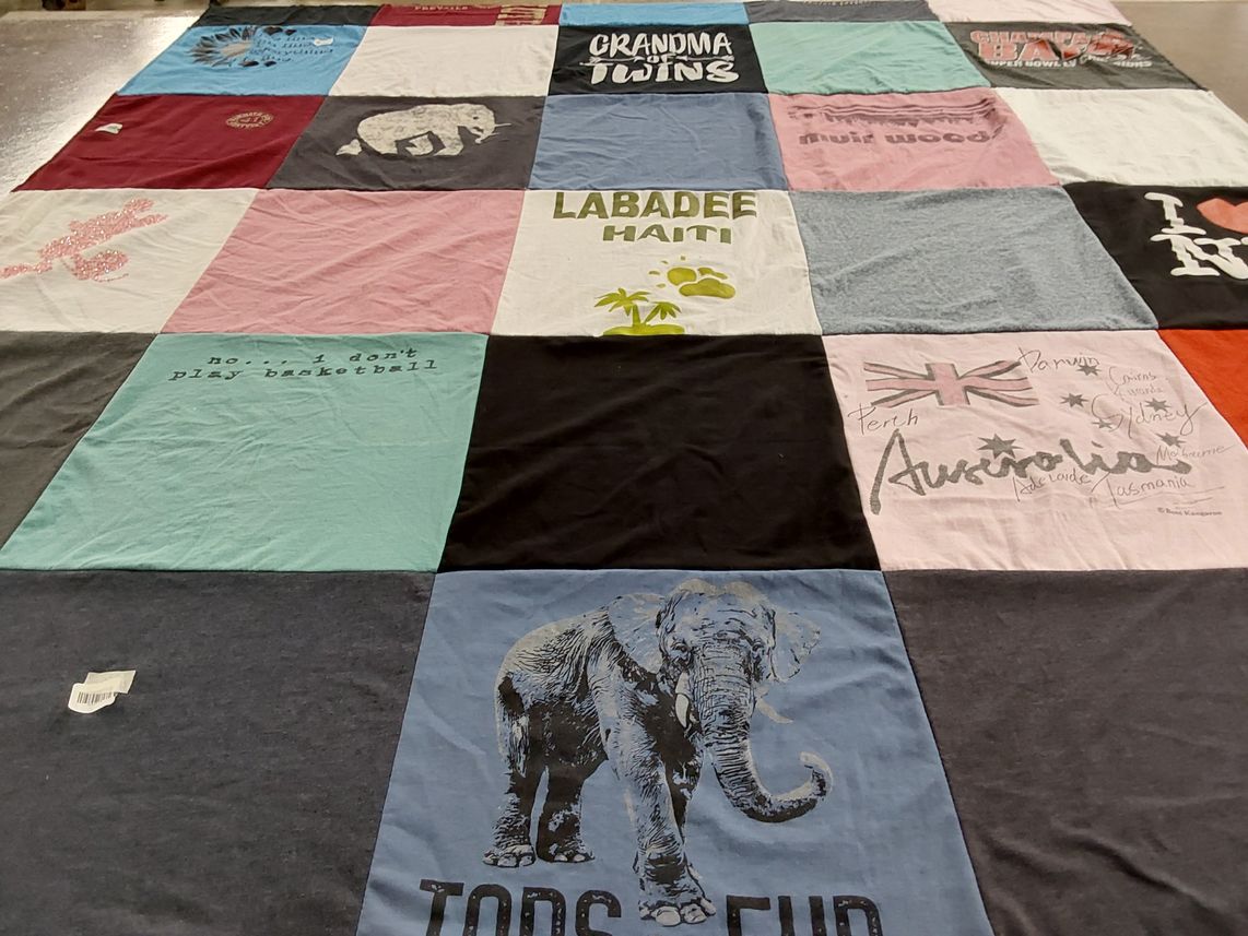 T-shirt quilt with travel, family themes by Debbie from FL