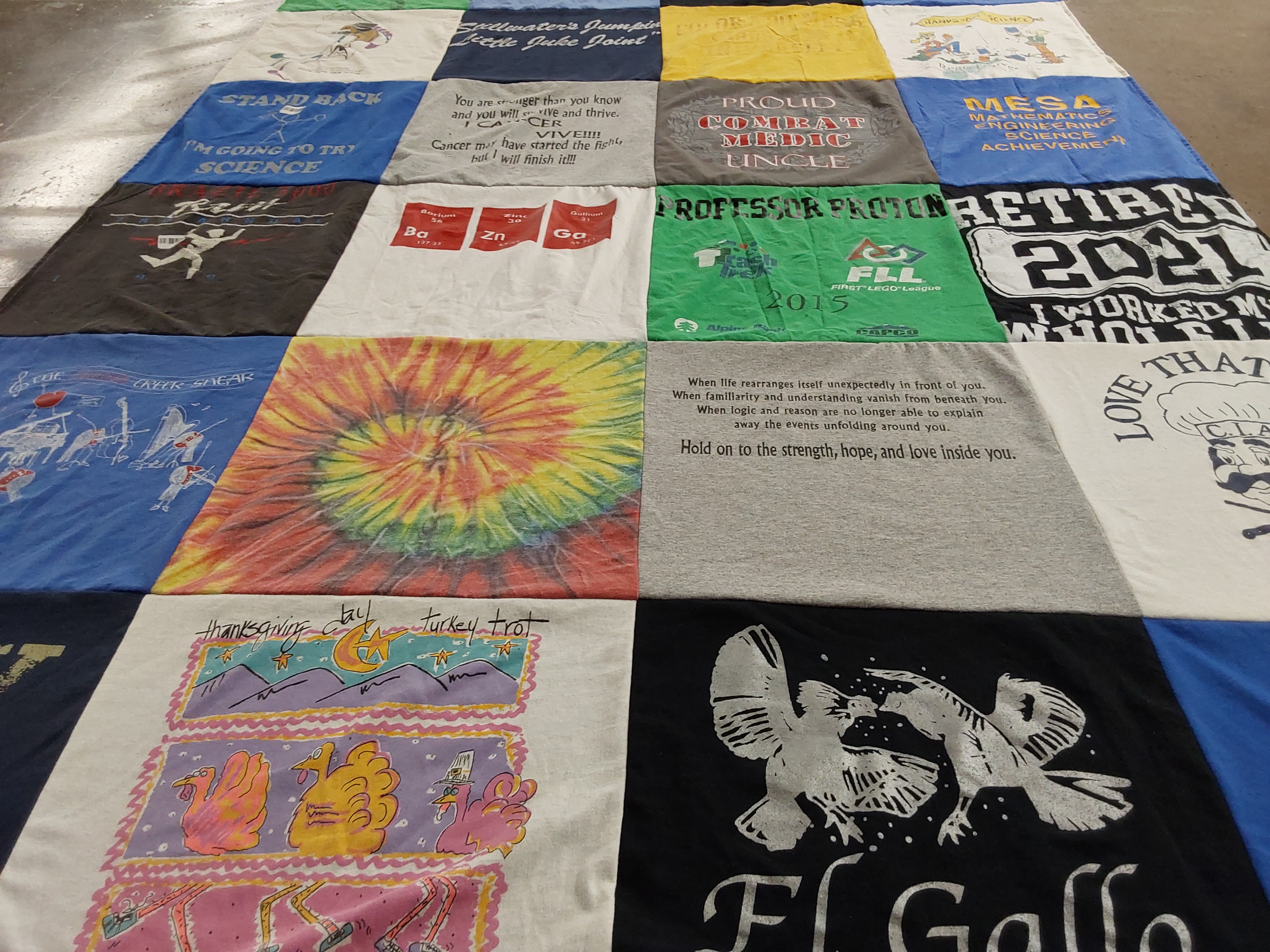 T-shirt quilt with science, engineering themes by Barb from CO