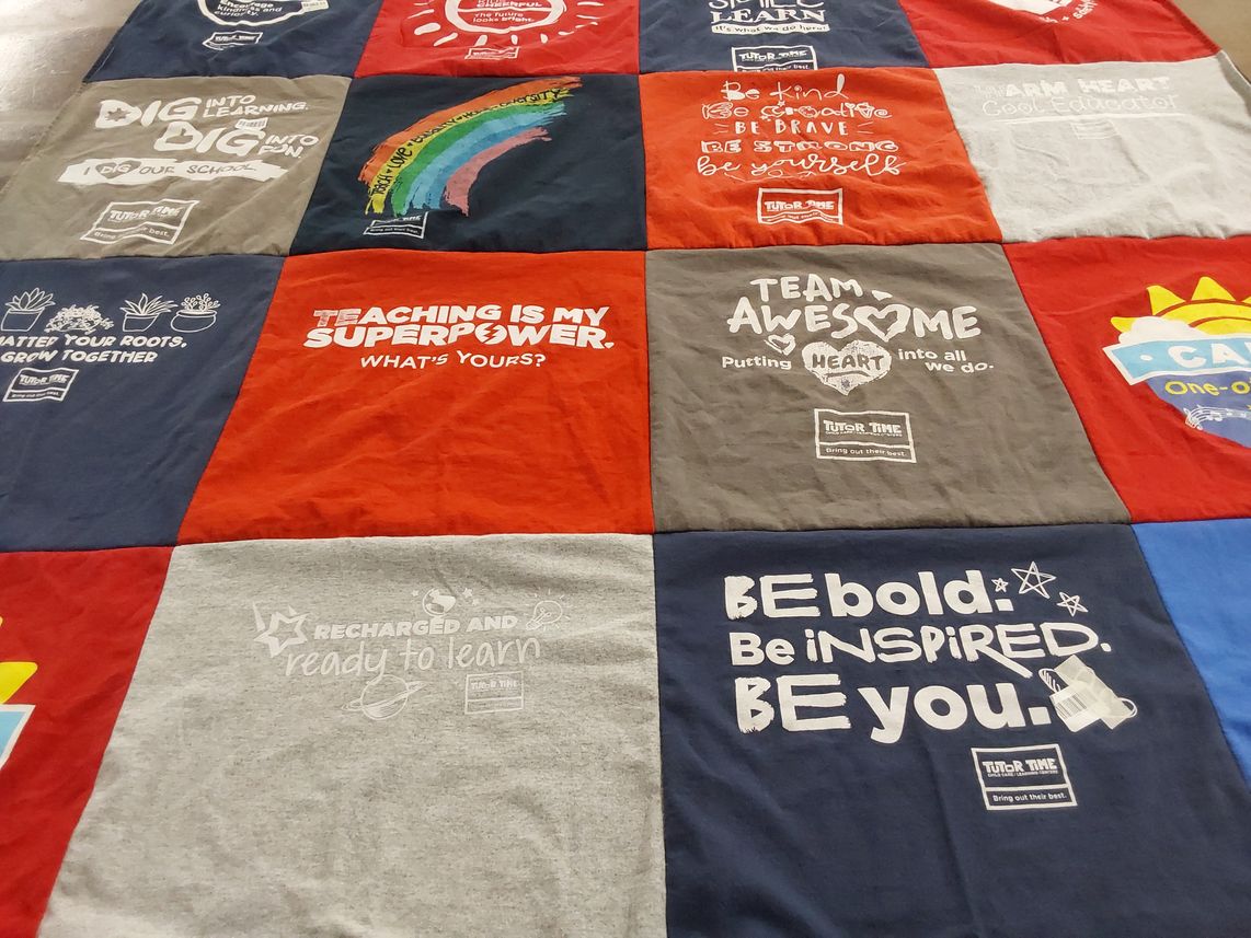 T-shirt quilt with education, teaching themes by Joyce from NJ