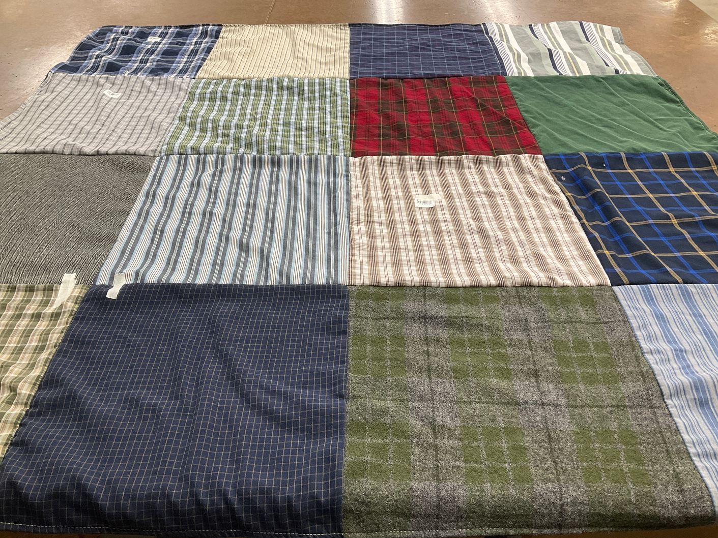 T-shirt quilt with textiles, quilting themes by Laura from MA
