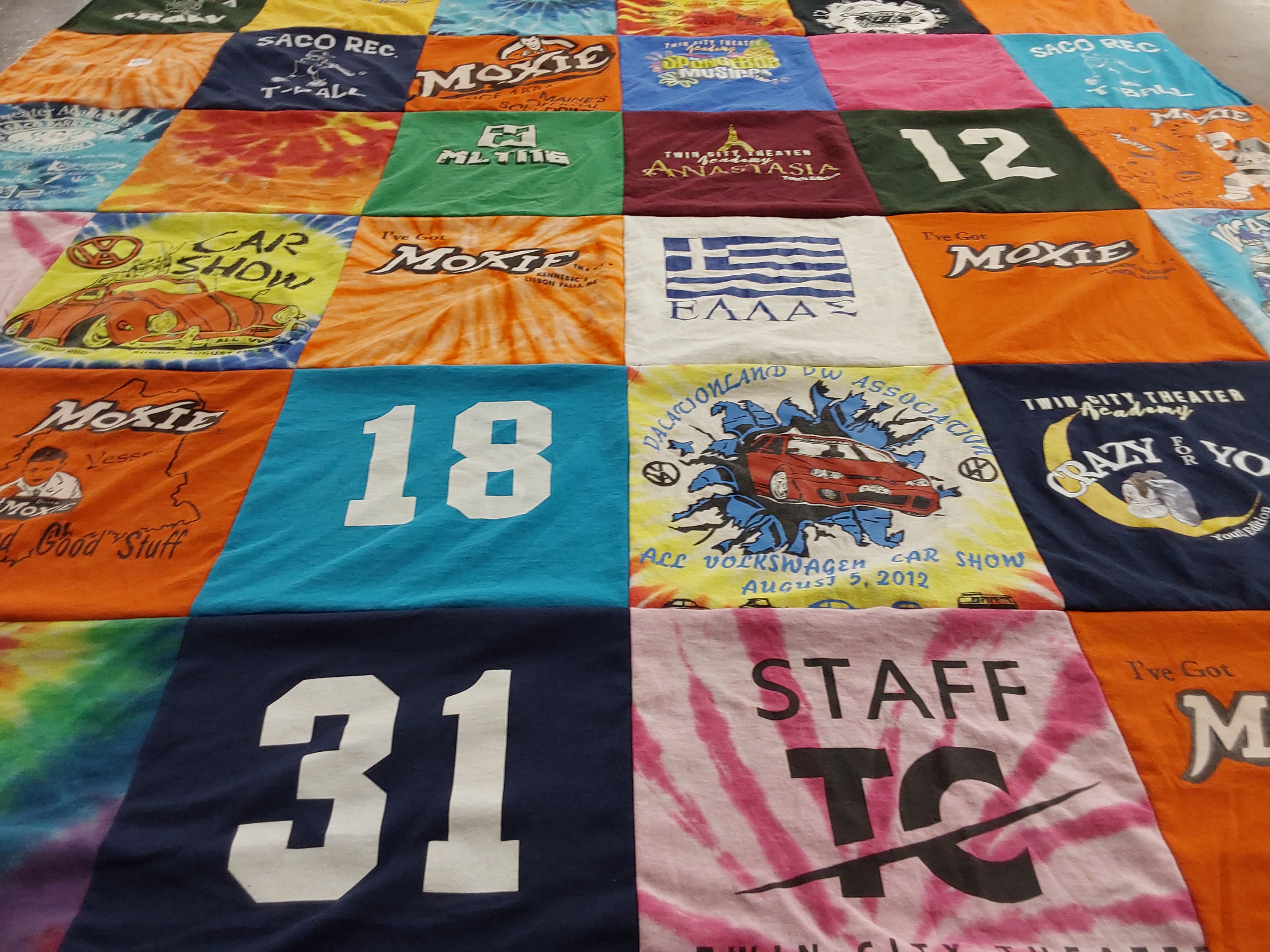 T-shirt quilt with theater, cars themes by Katherine from ME