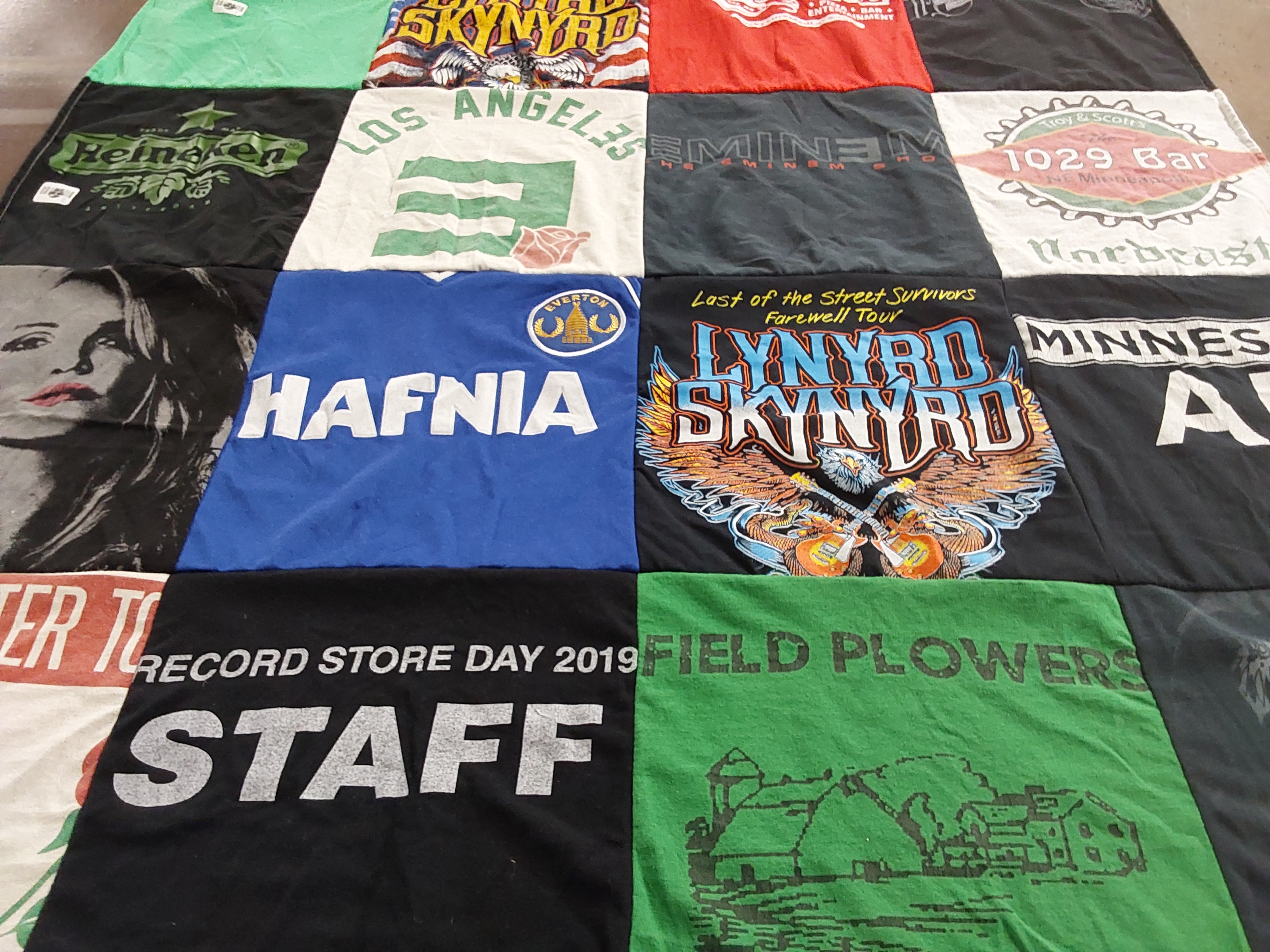 Custom Project Repat t-shirt quilt highlighting music, beer themes.
