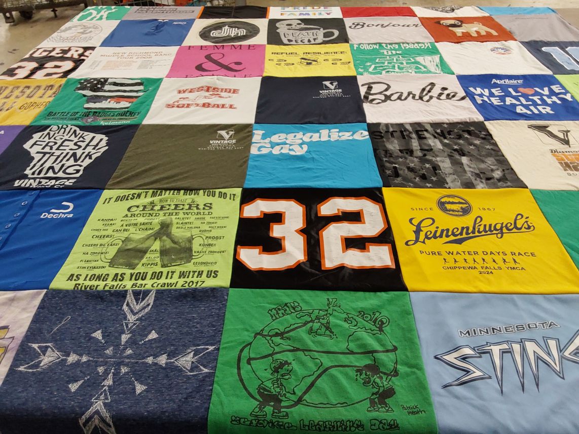 T-shirt quilt with sports, community events themes by Emma from WI