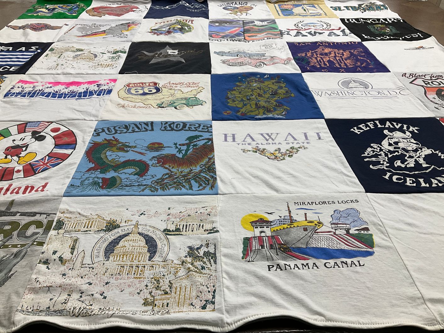 T-shirt quilt with travel, geography themes by Bridget from OK
