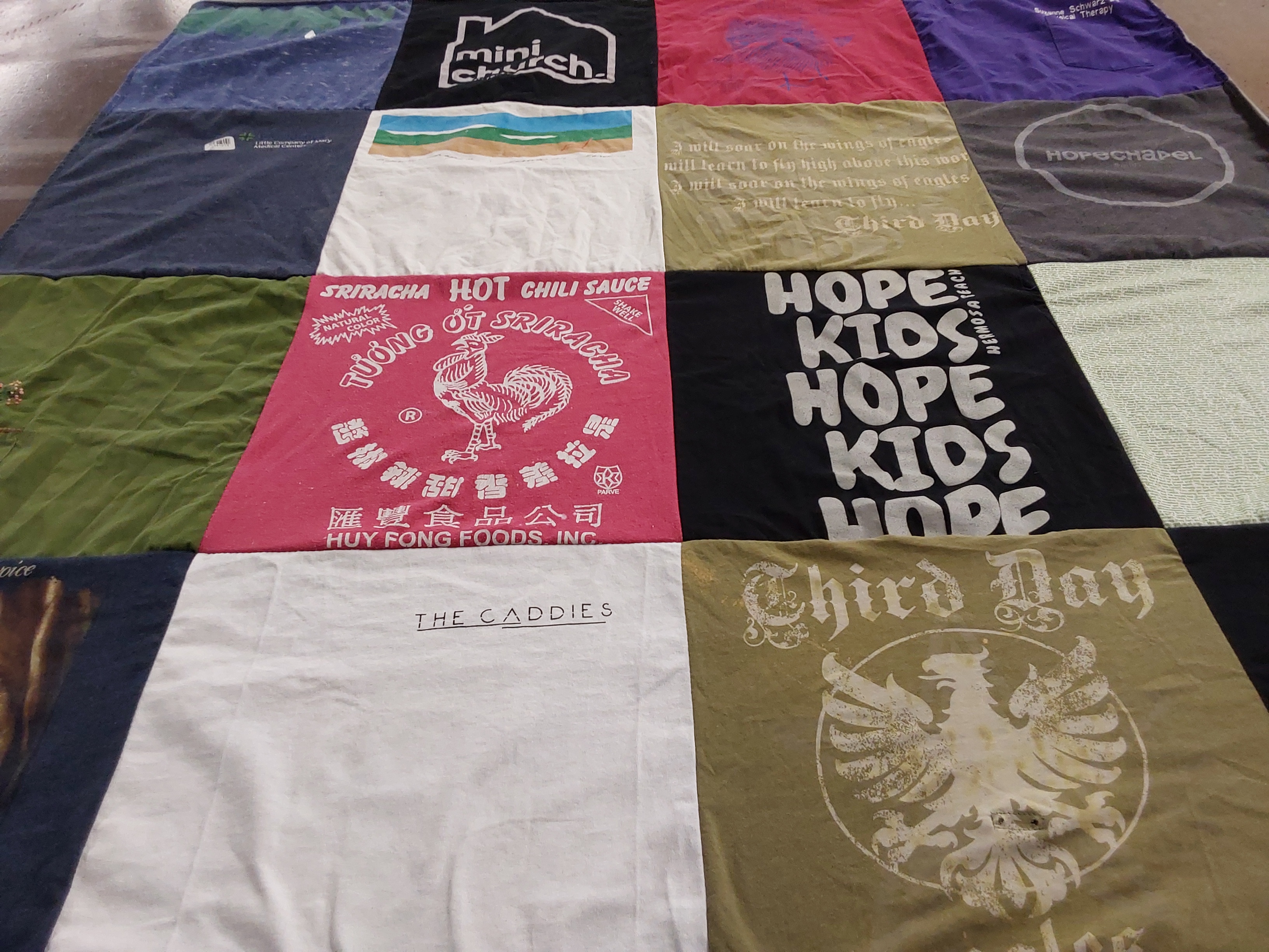 T-shirt quilt with cooking, music themes by Suzanne from CA