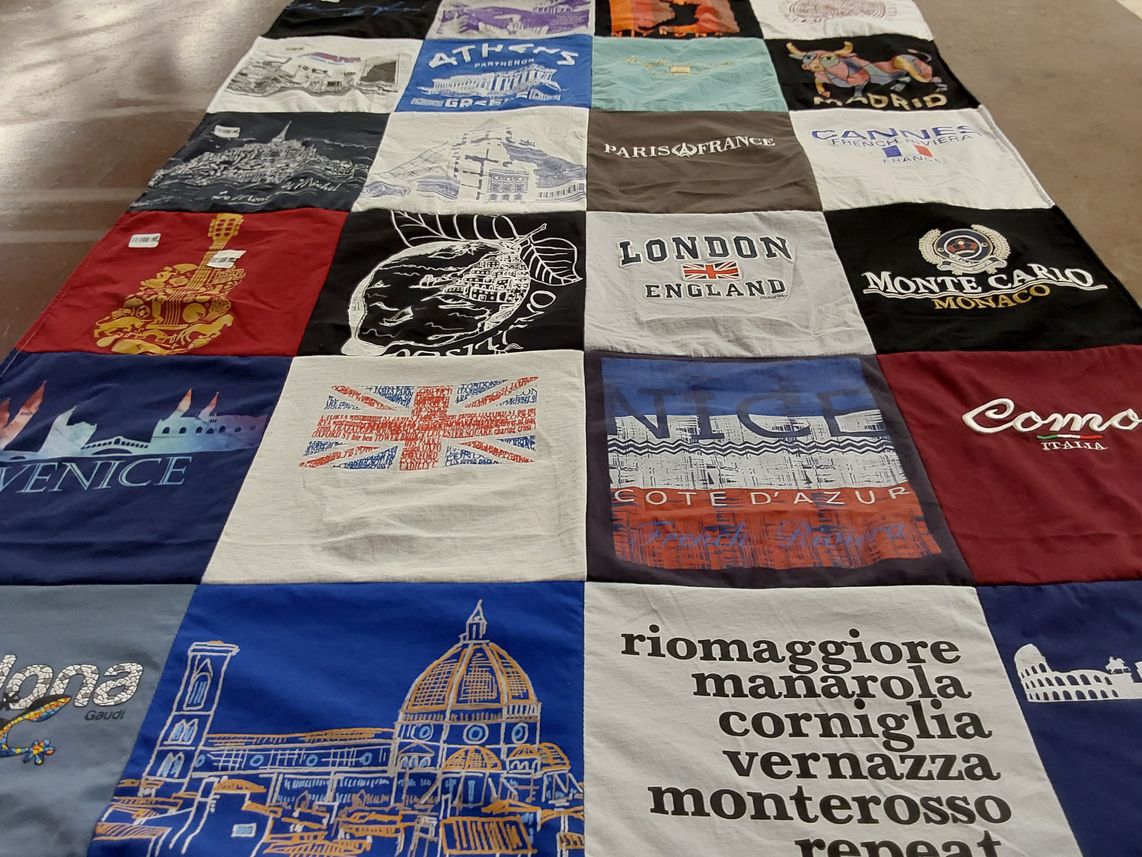 T-shirt quilt with travel, photography themes by Kim from GA