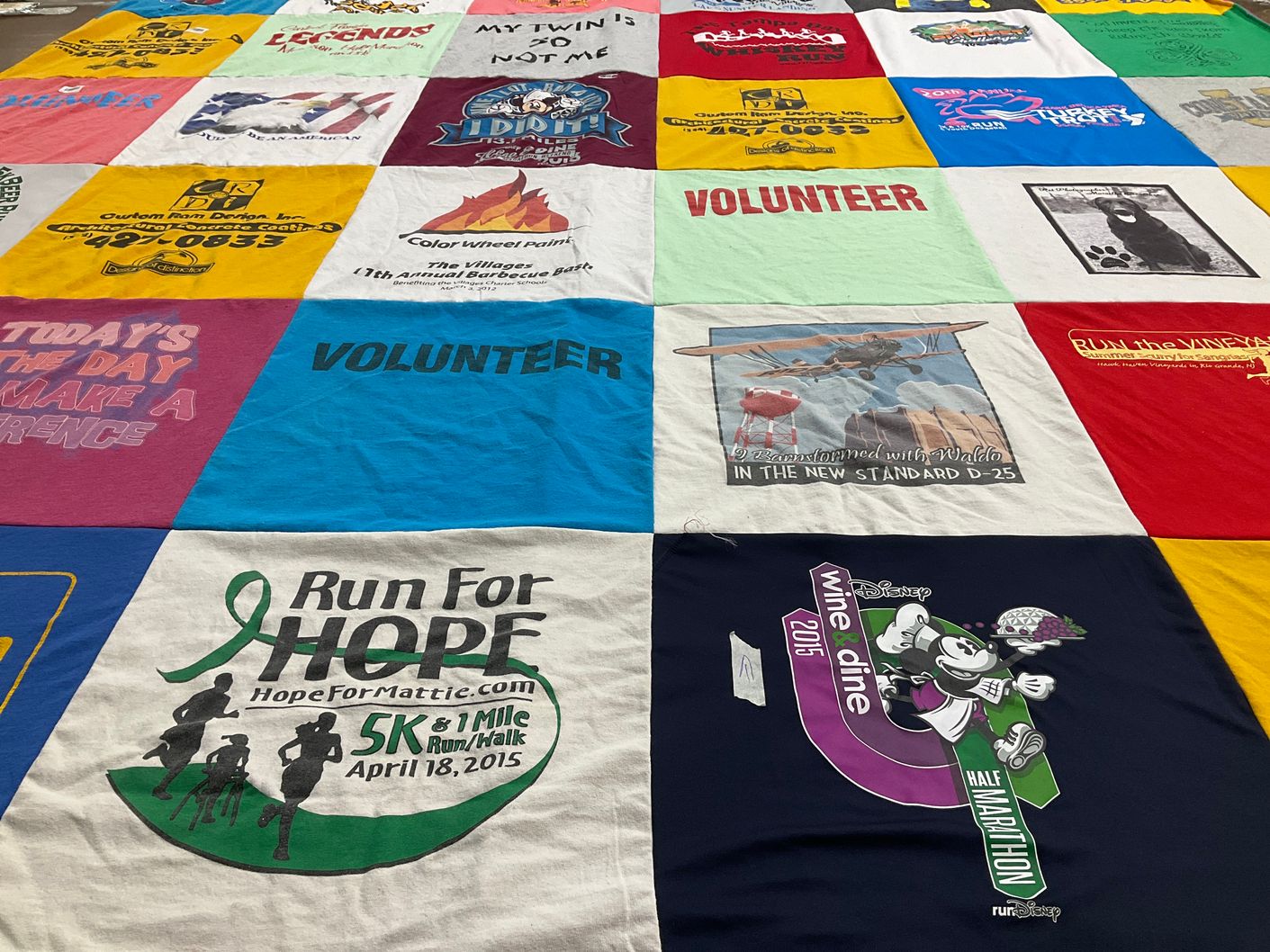 T-shirt quilt with volunteering, running themes by Marieann from FL