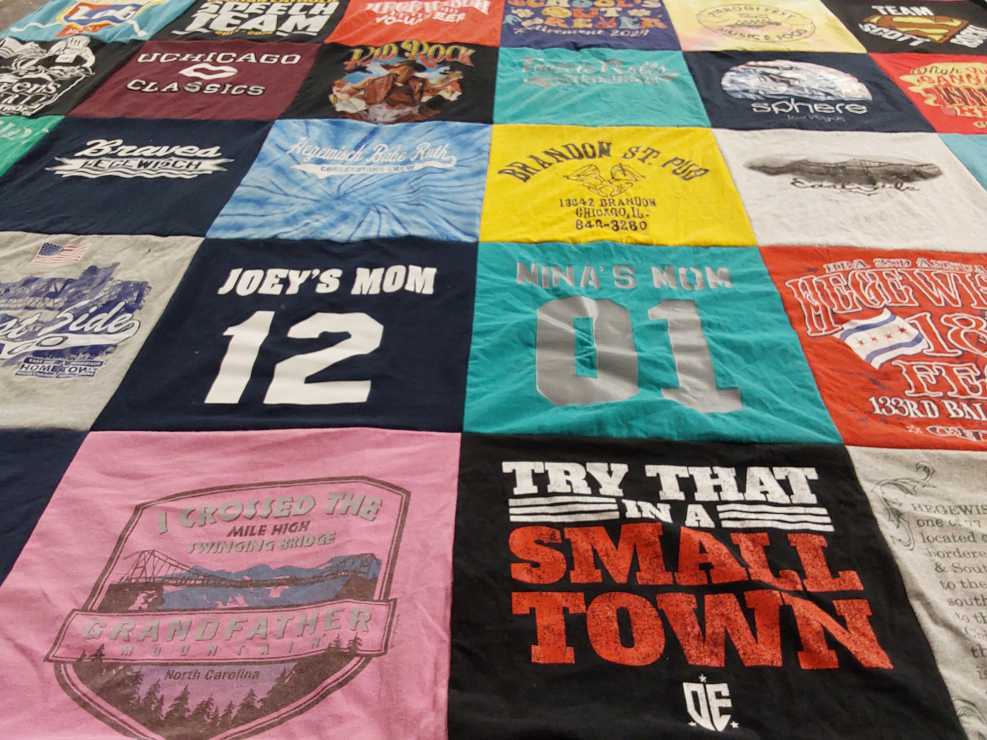 T-shirt quilt with hiking, travel themes by Kathy from IL