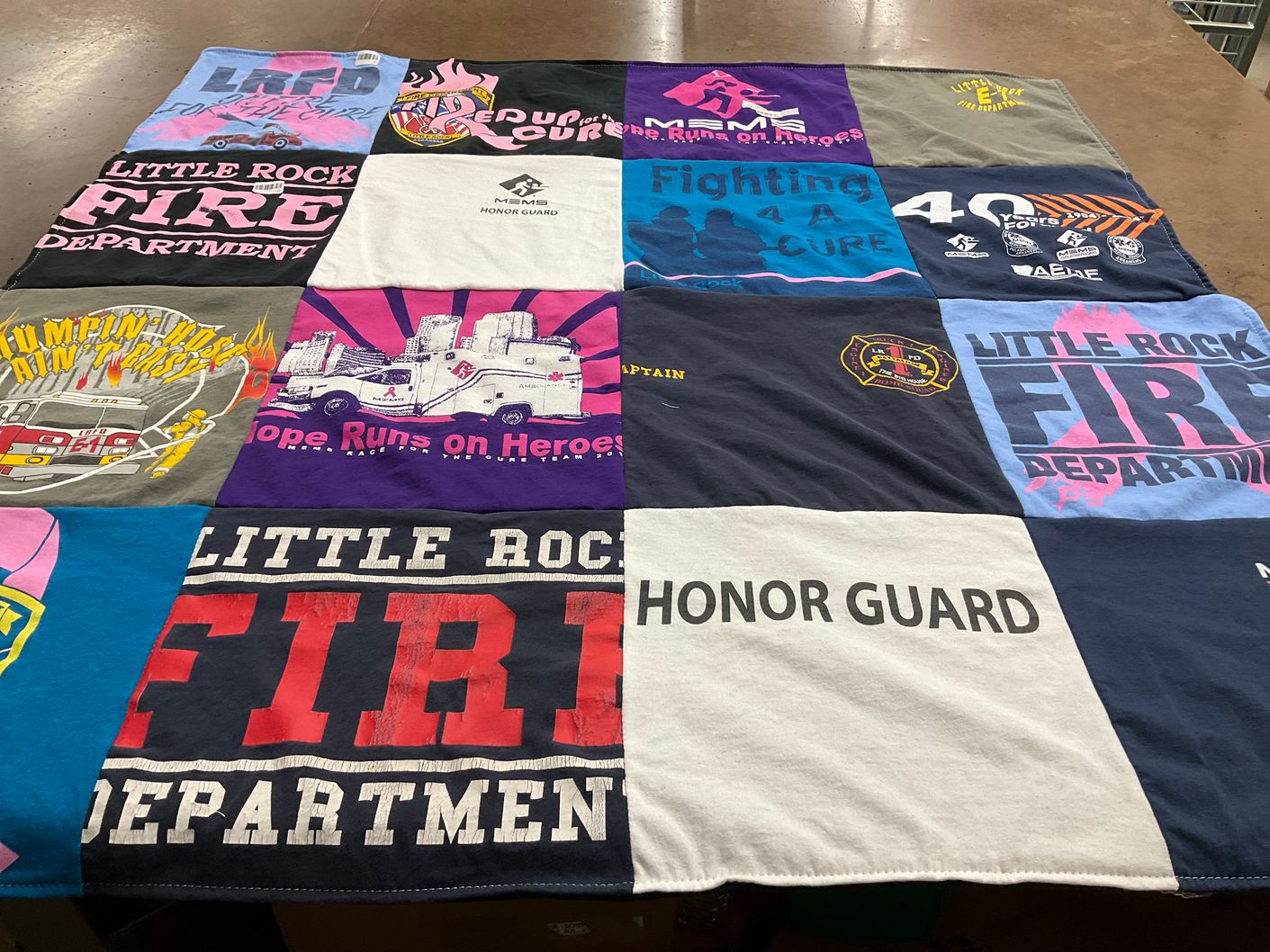 T-shirt quilt with firefighting, community service themes by Janie from AR