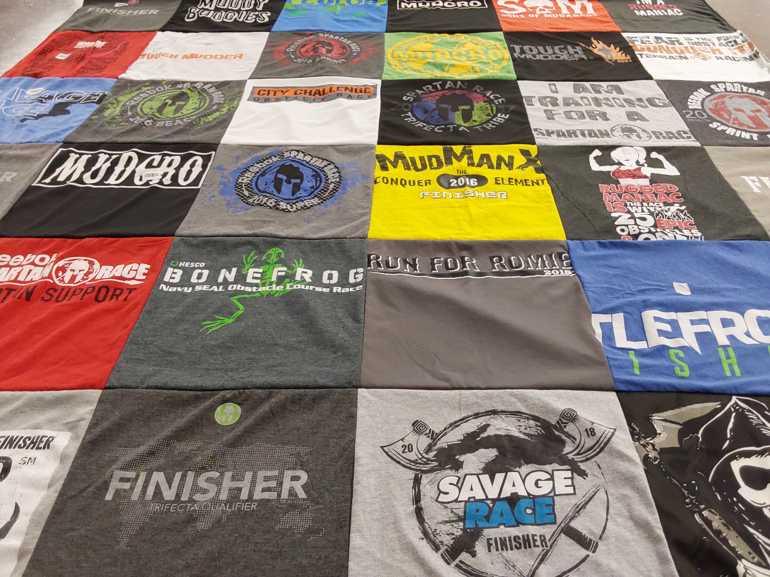 T-shirt quilt with obstacle course racing, fitness themes by JodiAnn from NJ