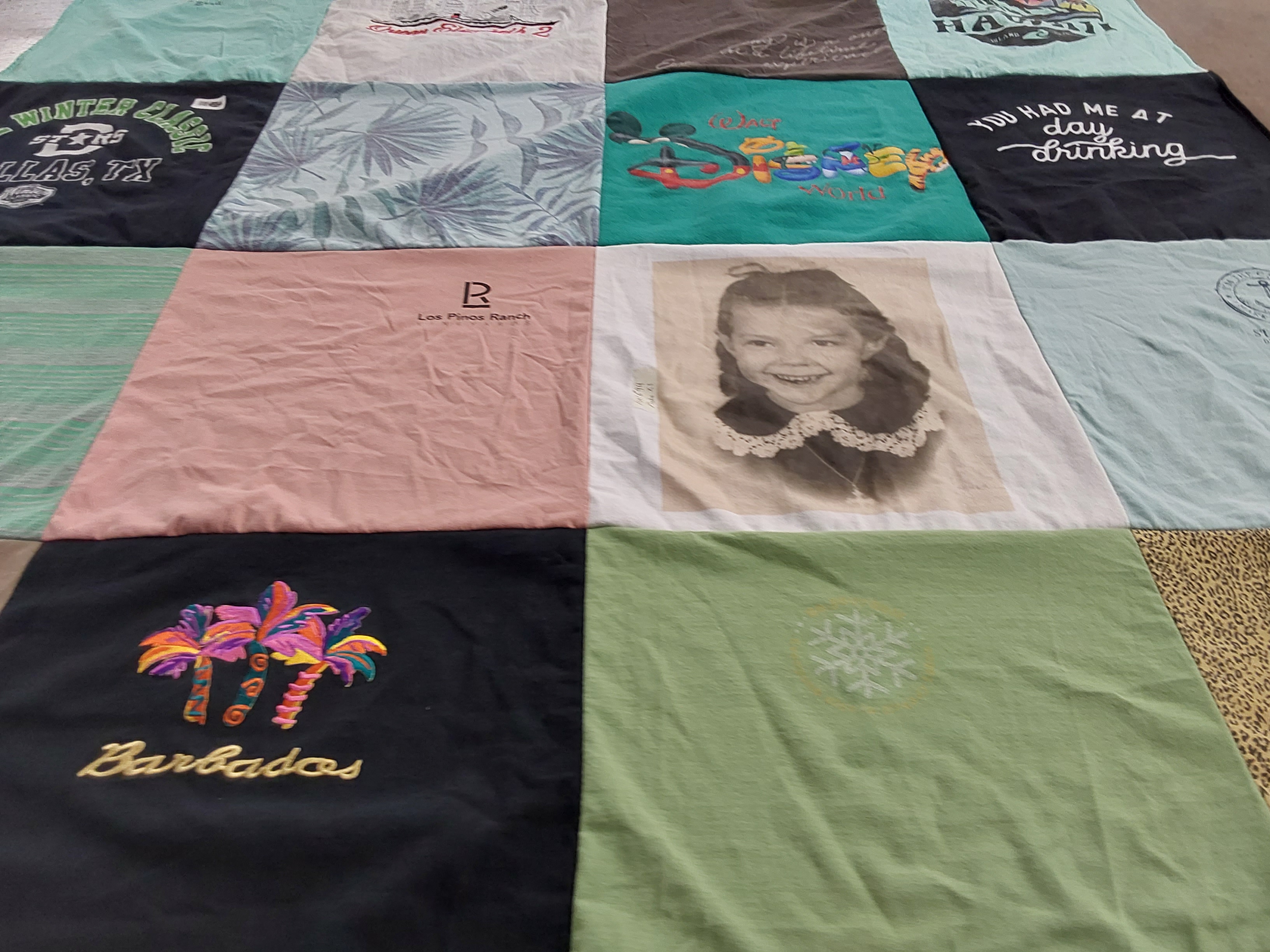 T-shirt quilt with travel, drinking themes by Debbi from TX
