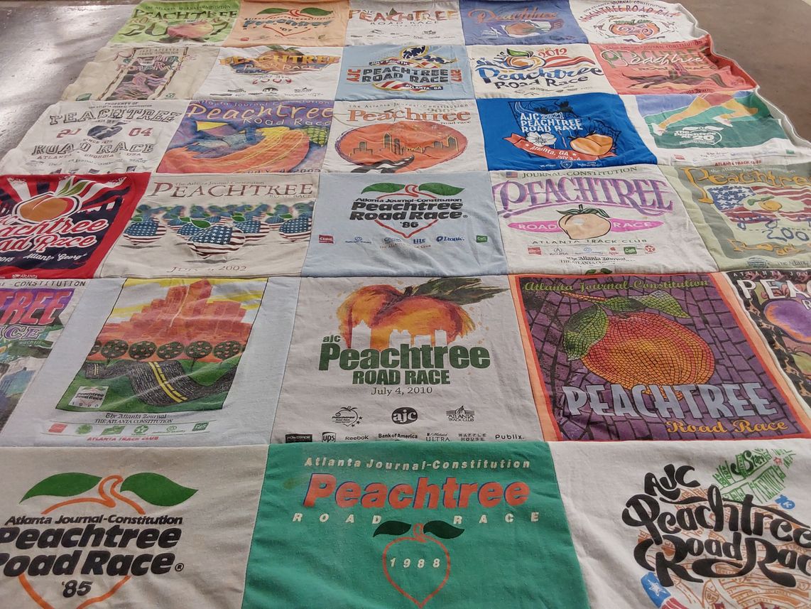 T-shirt quilt with running, sports themes by Annie from GA