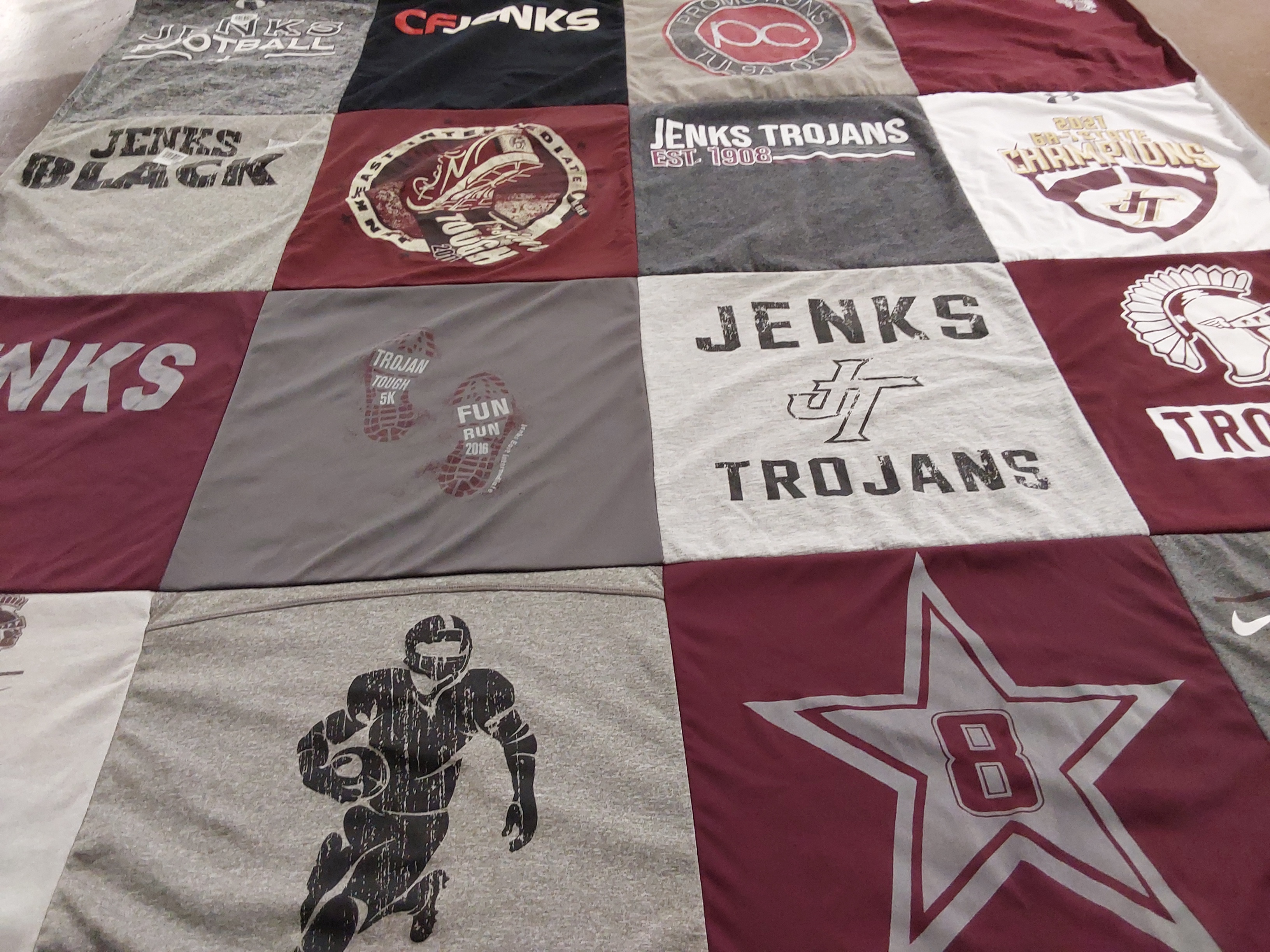 T-shirt quilt featuring jenks trojans by Tesla from OK