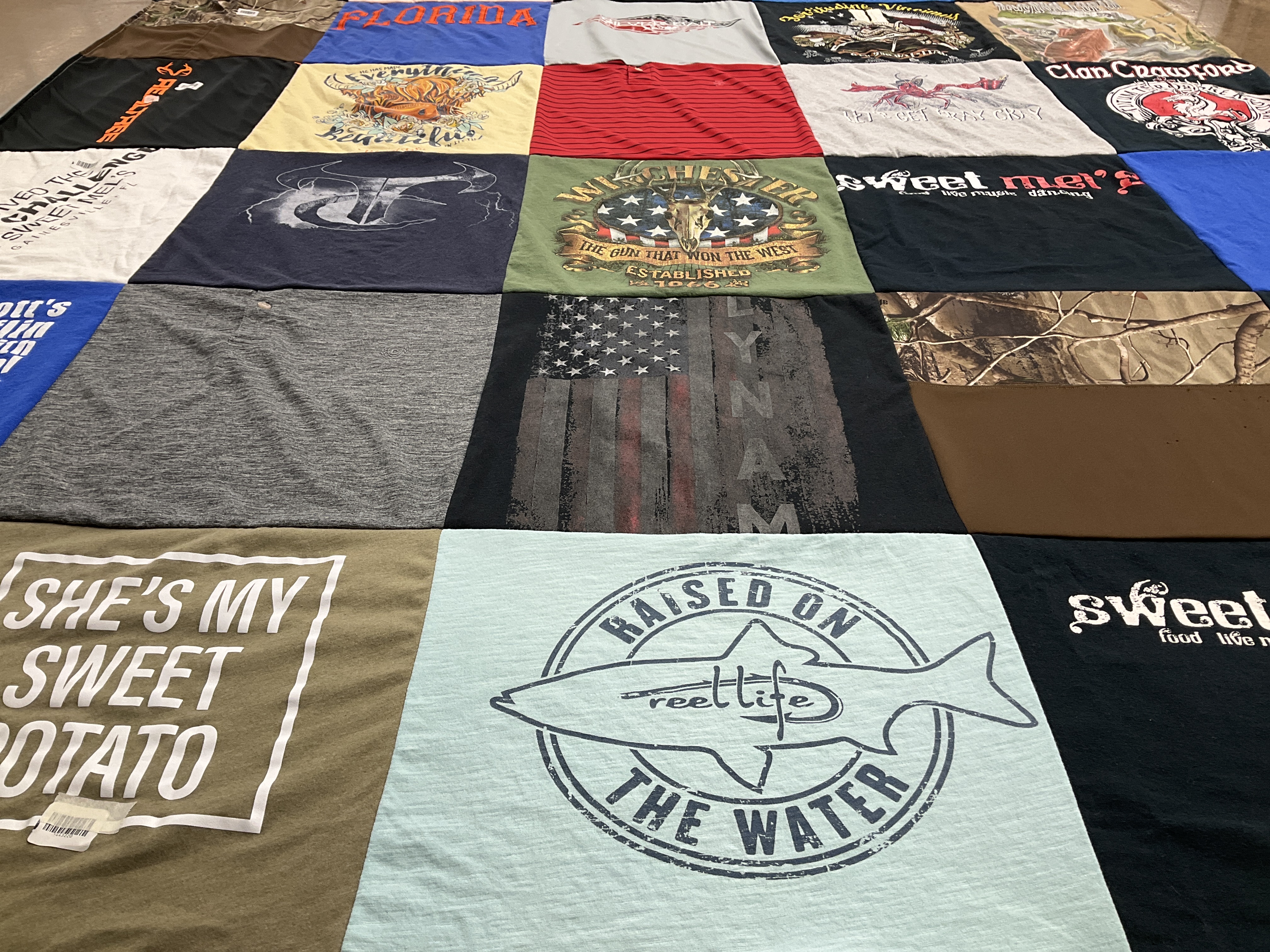 T-shirt quilt with fishing, cooking themes by Melinda from FL