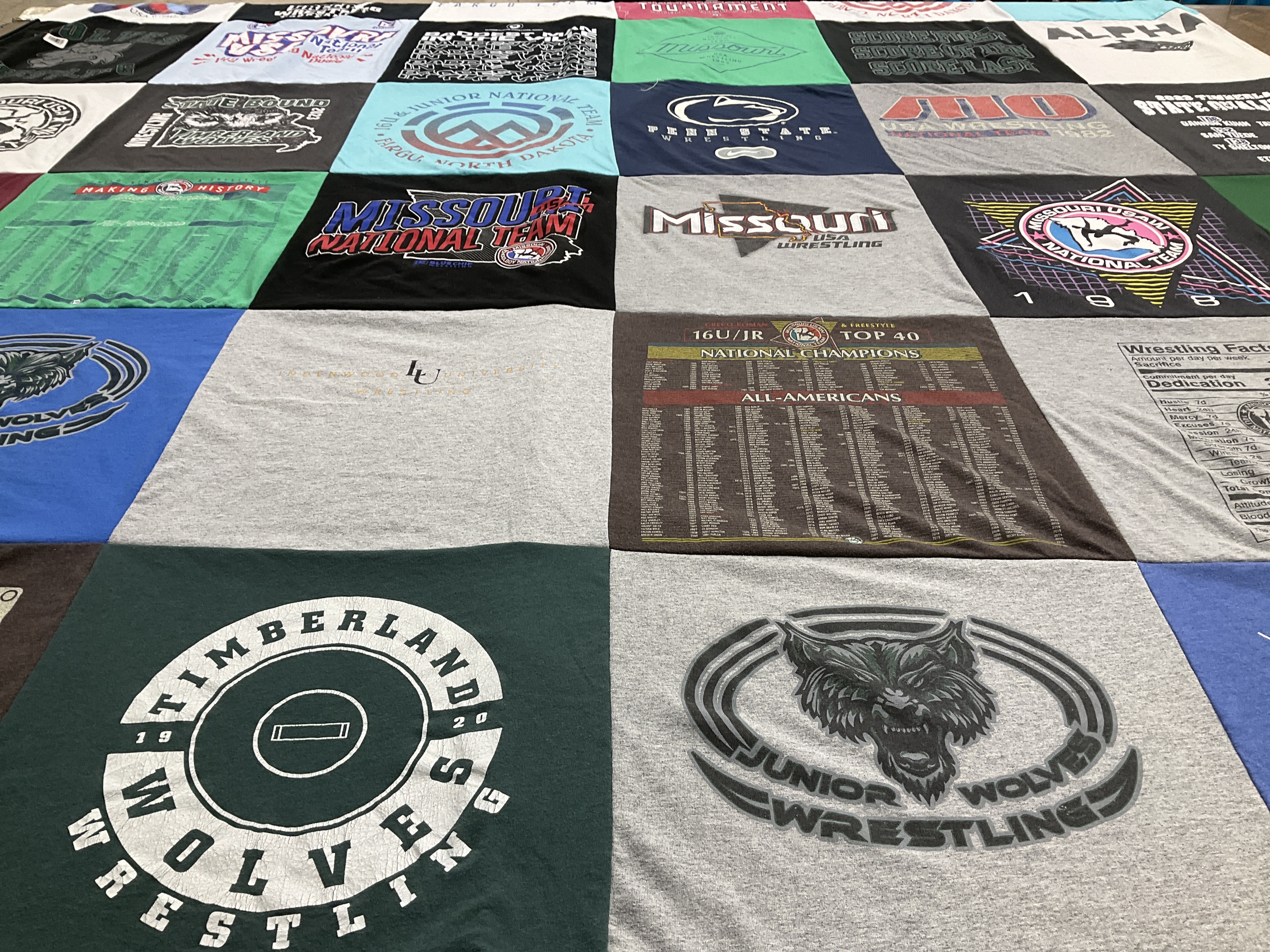 T-shirt quilt featuring timberland wolves wrestling by Jane from MO