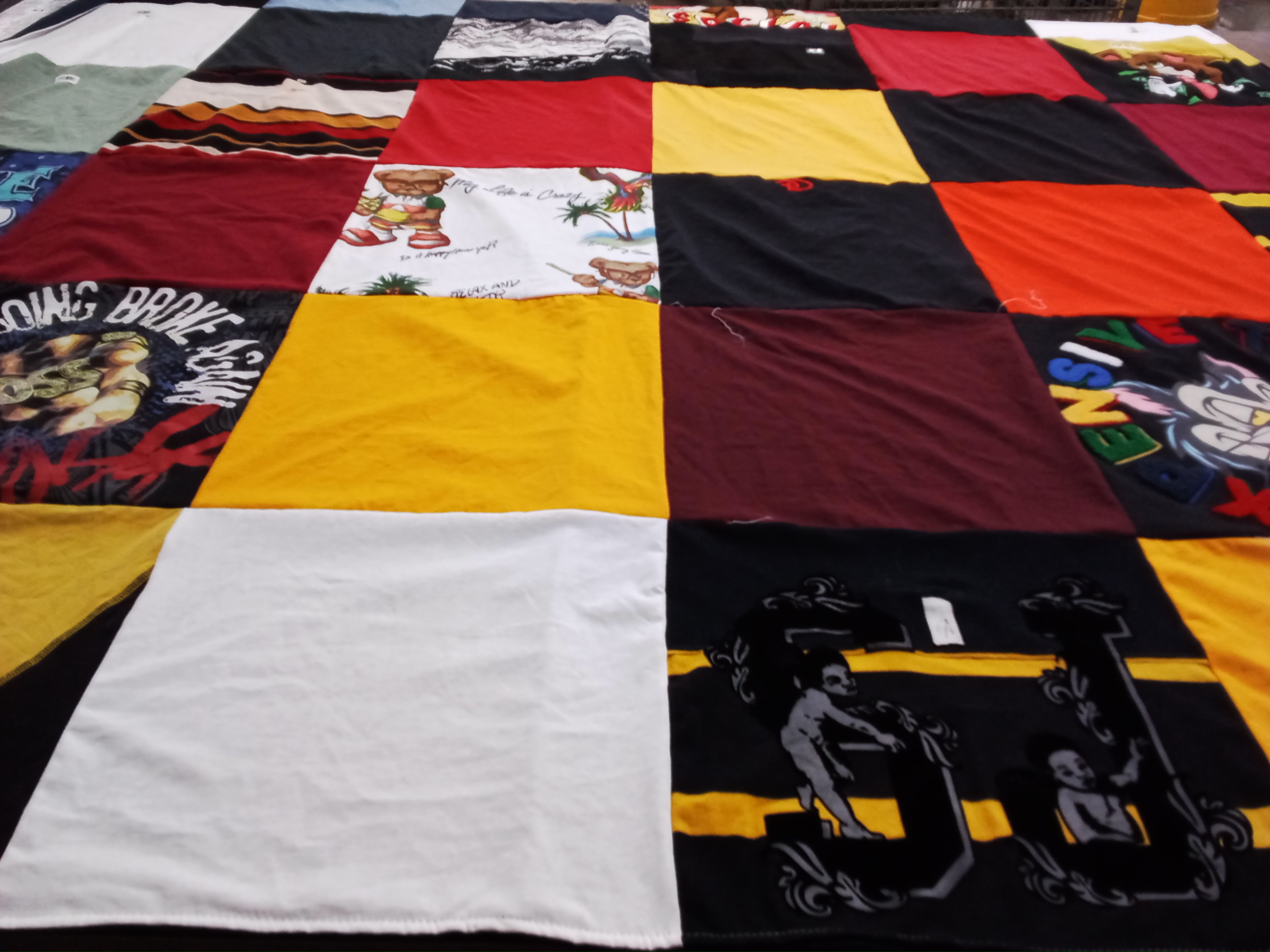 T-shirt quilt with sports, music themes by Willie from OH