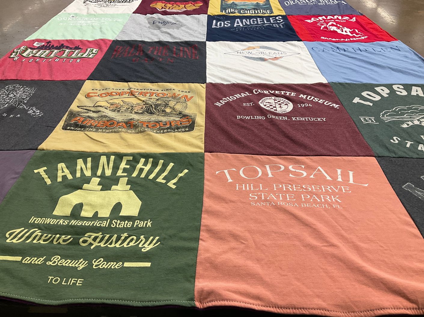 T-shirt quilt with travel, outdoor activities themes by Stacy from AL