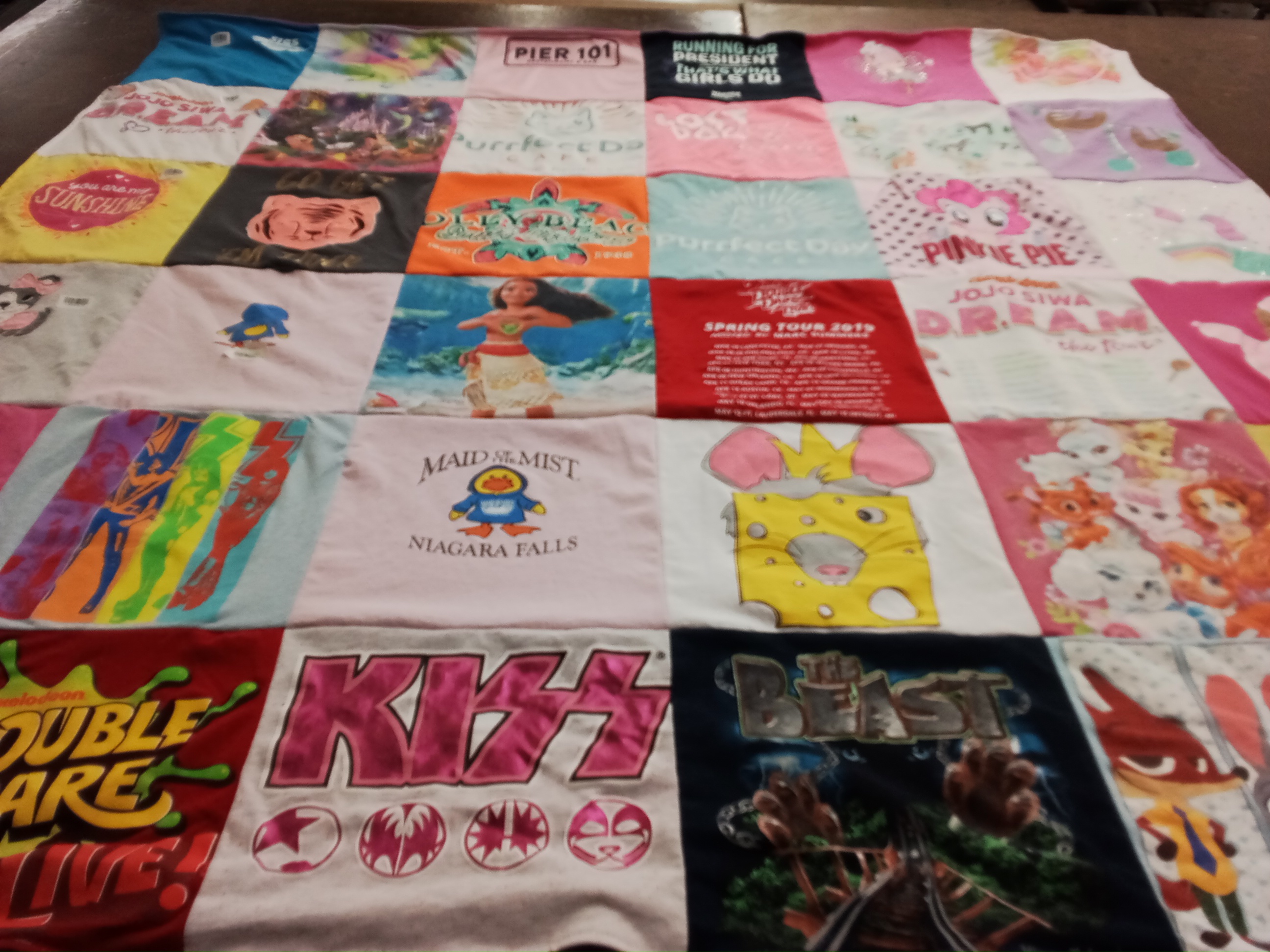 T-shirt quilt with disney, music themes by Laura from IN