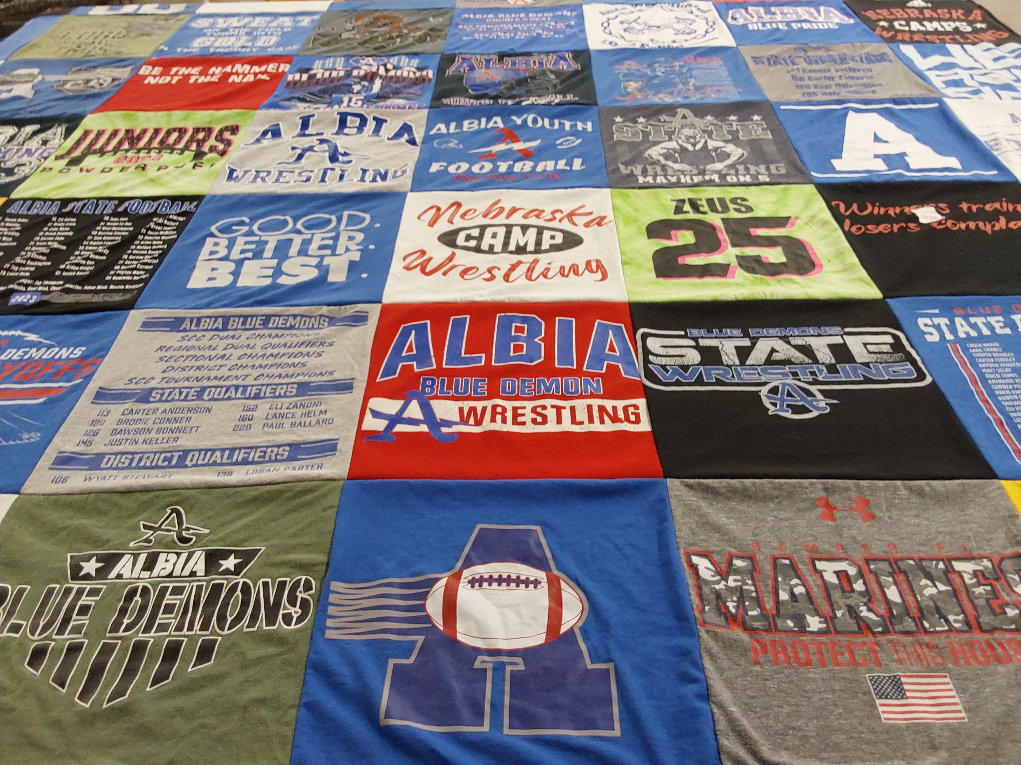 T-shirt quilt featuring albia blue demons by Melissa from IA