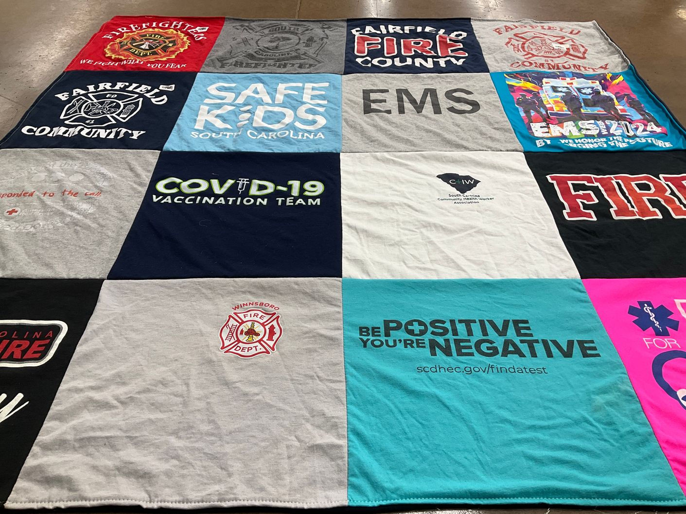 T-shirt quilt with fire safety, community support themes by Layla from SC