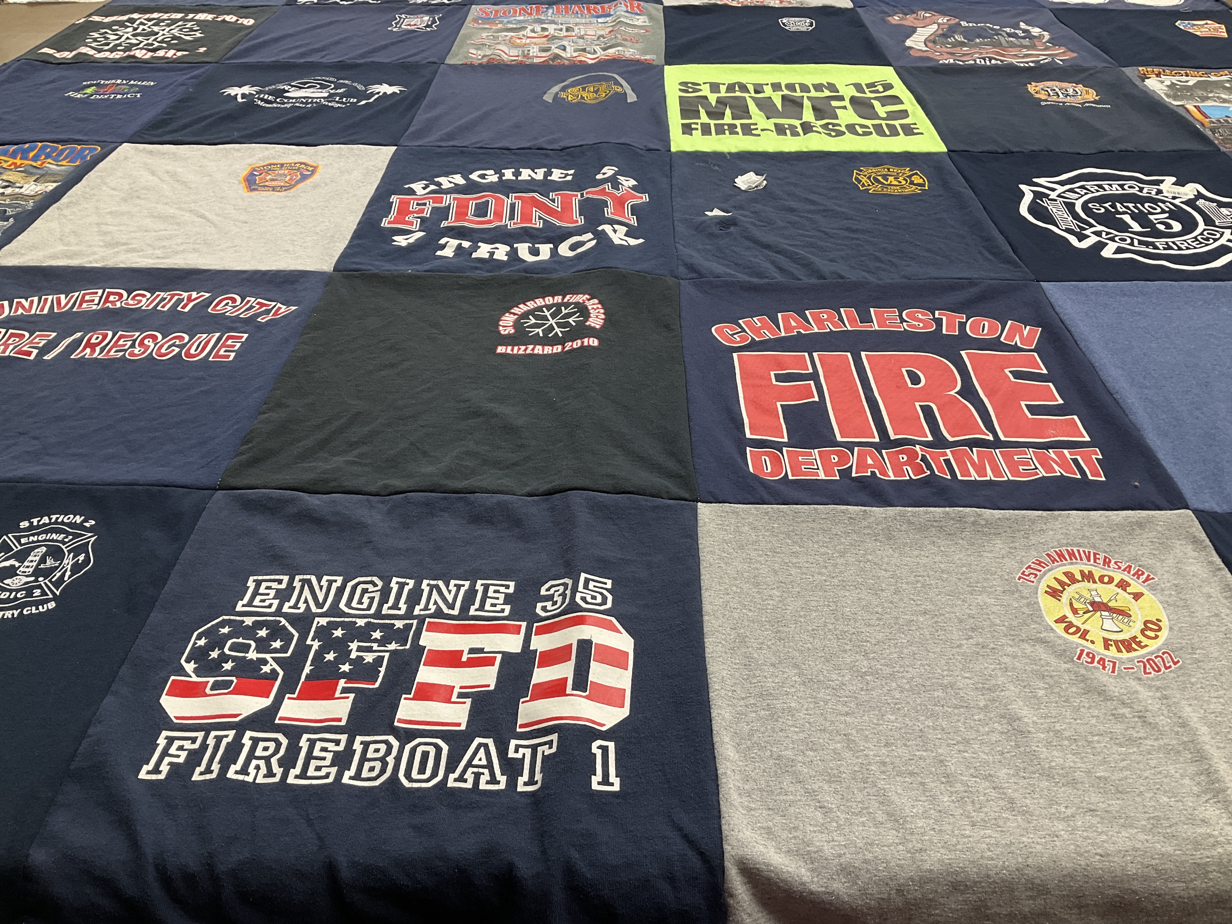 T-shirt quilt with firefighting, community service themes by Michelle from PA
