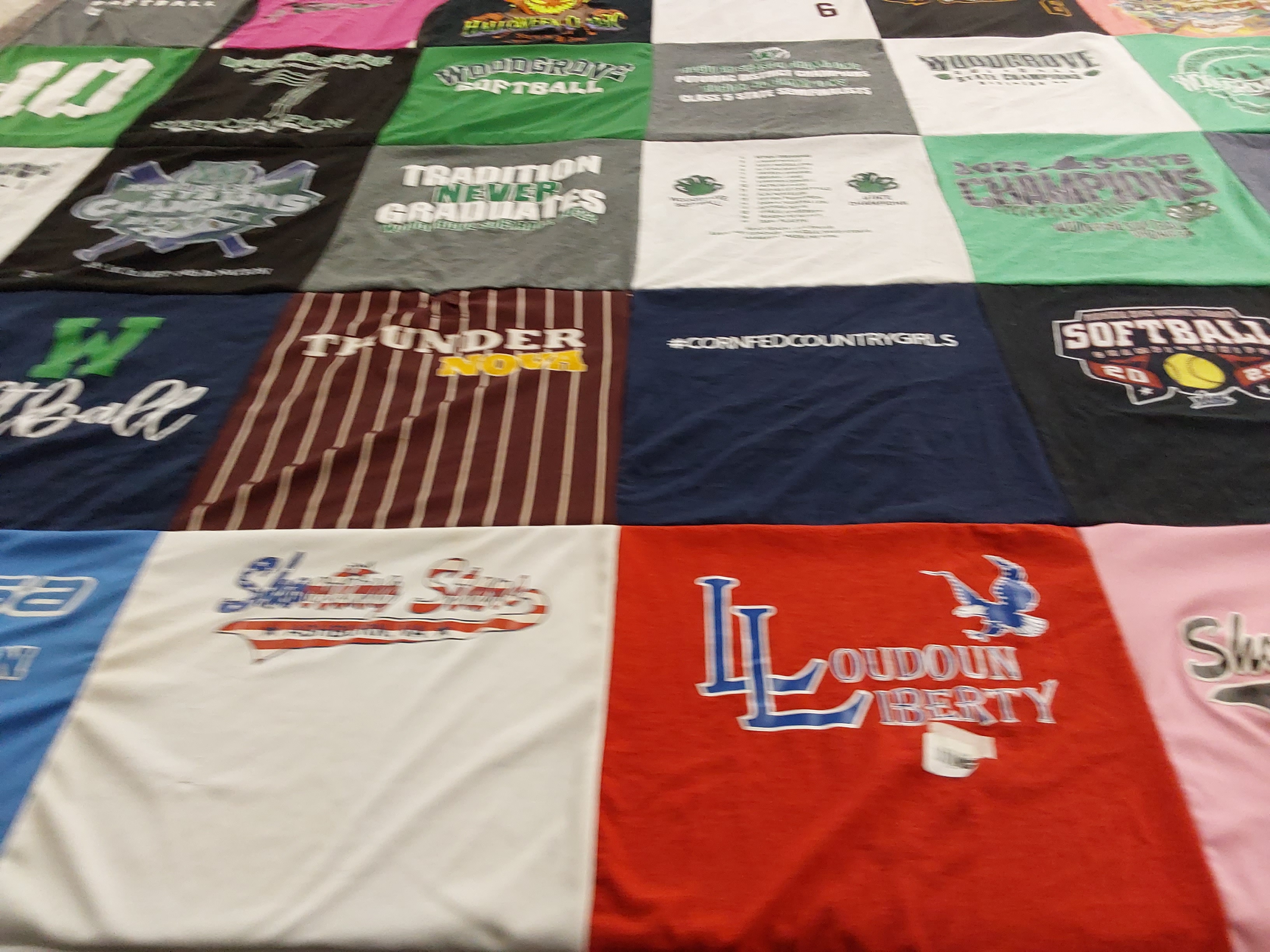 Custom Project Repat t-shirt quilt featuring shirts from loudoun liberty high school, woodgrove high school.