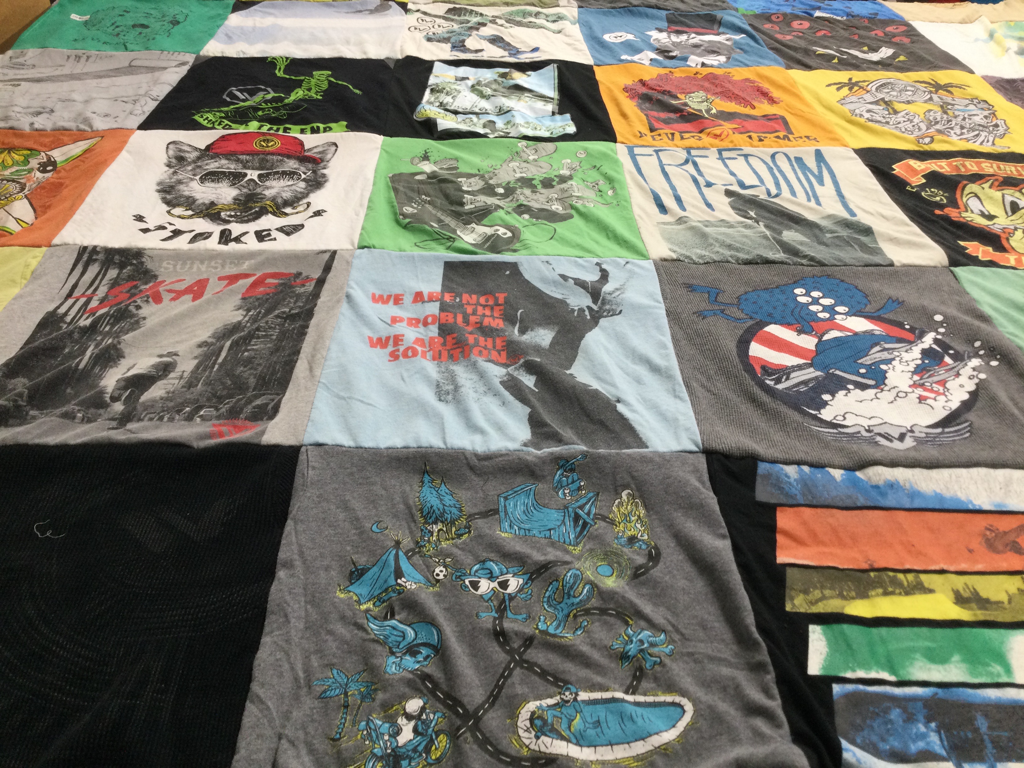 T-shirt quilt with skateboarding, surfing themes by Leilani from CA