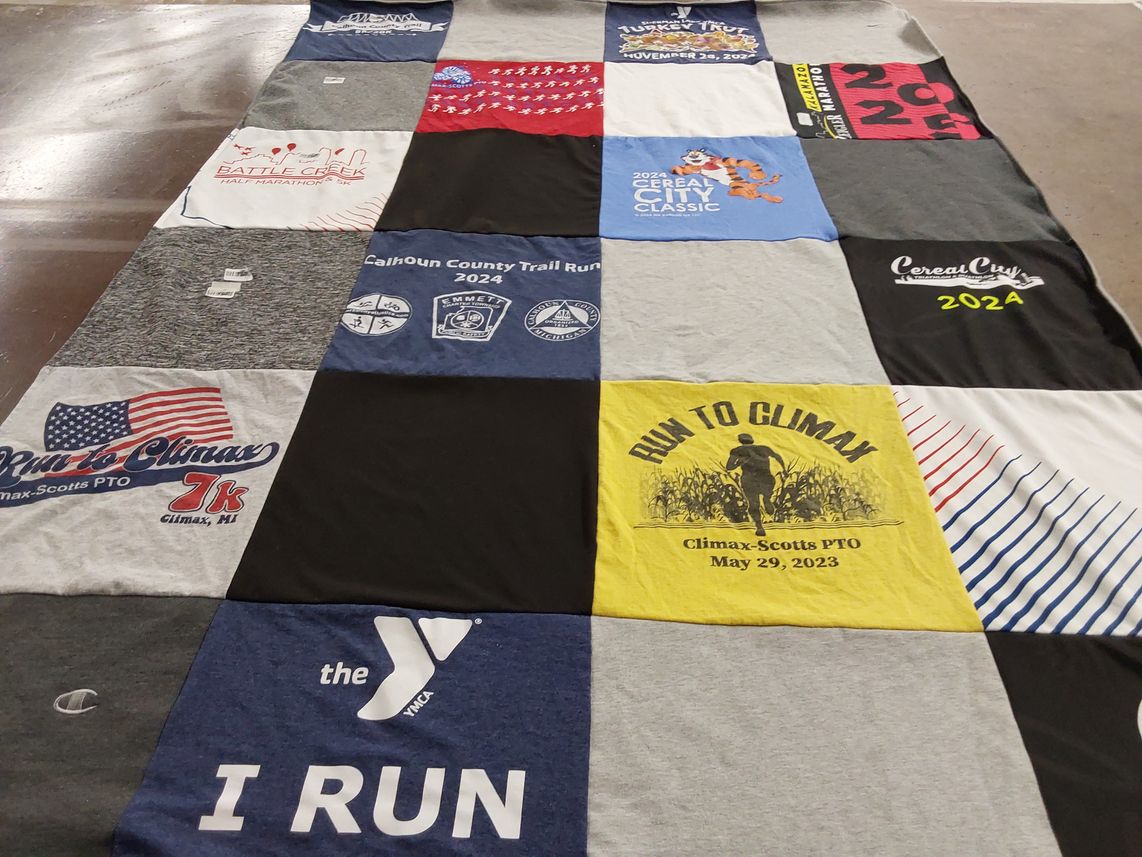 T-shirt quilt with running, community events themes by Jennifer from MI