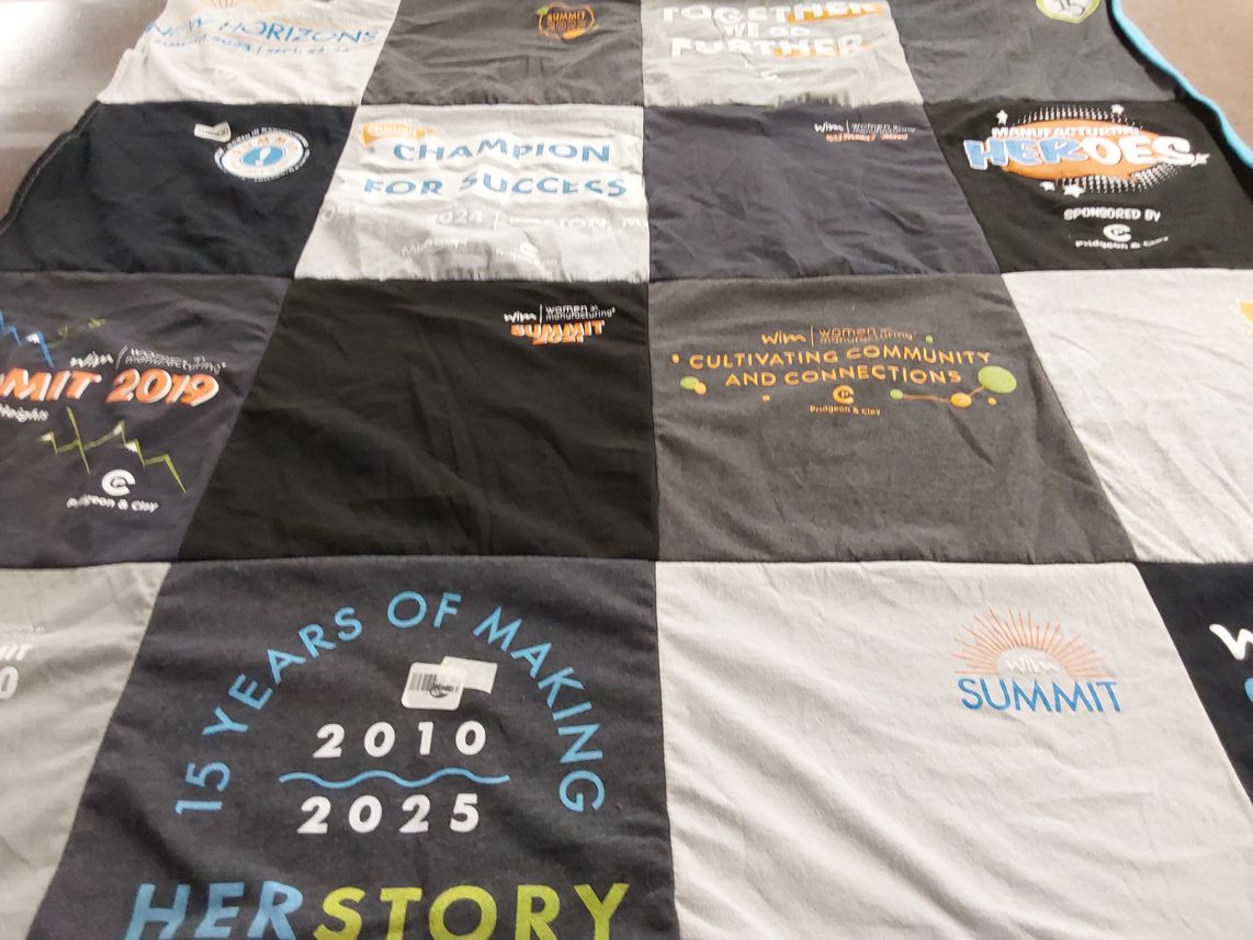 T-shirt quilt with women's empowerment, community building themes by Lynn from NC