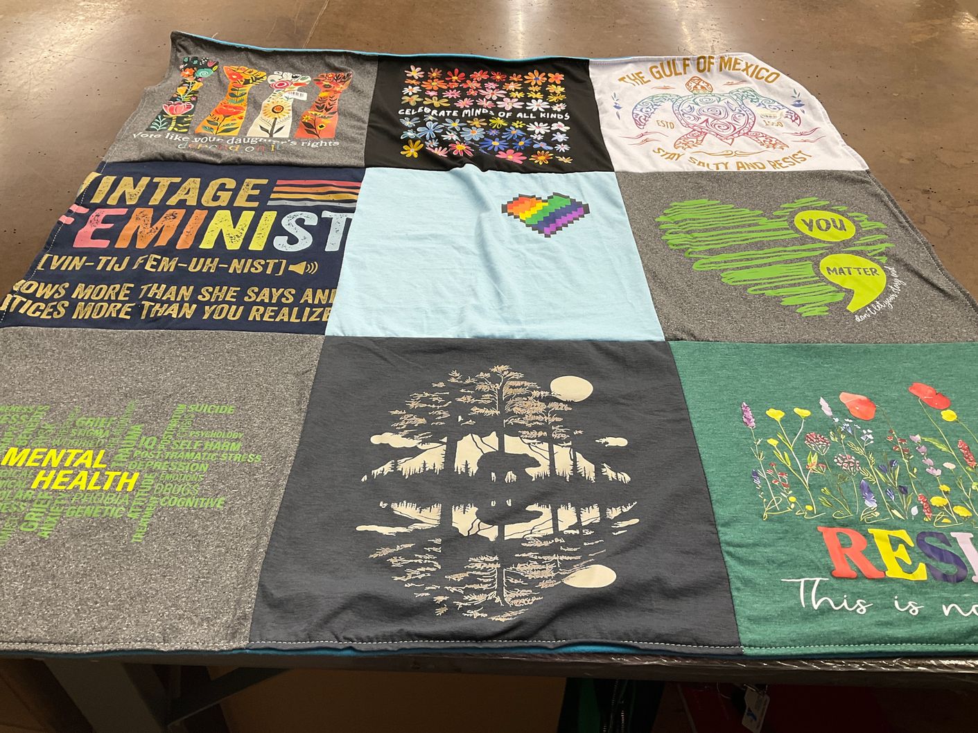 T-shirt quilt with feminism, mental health themes by Kimberly from TX