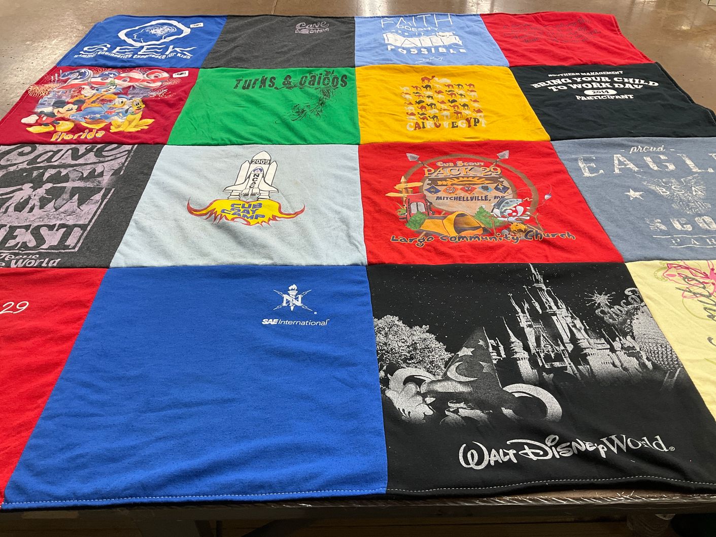 T-shirt quilt with travel, community service themes by Kendra from MD