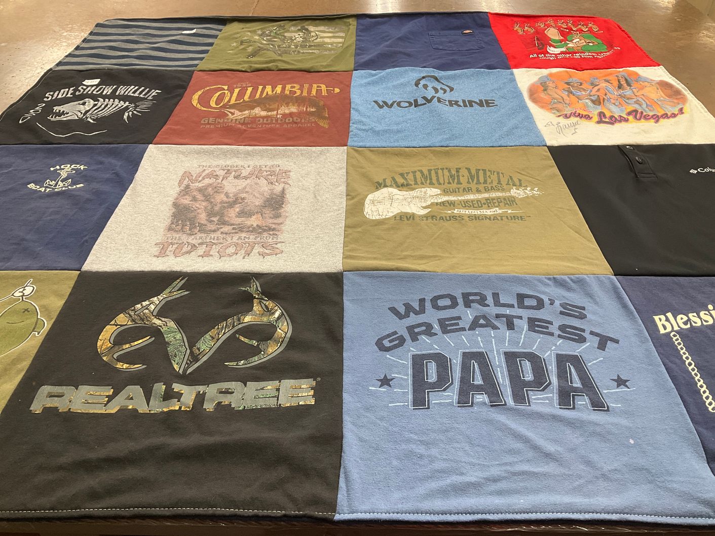 T-shirt quilt with fishing, hunting themes by Jo -An from NY